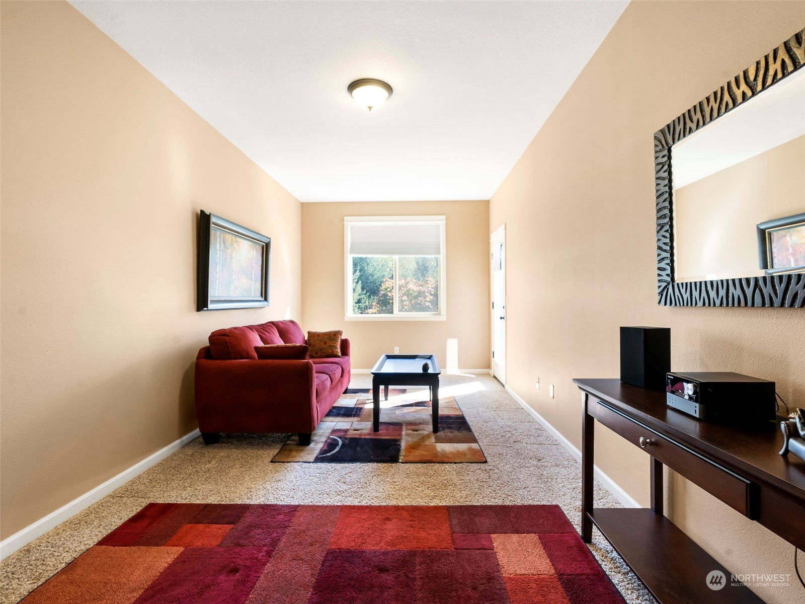 17005 Northeast 33rd Avenue Ridgefield, WA 98642 - Photo 12 of 38 a living room with furniture and a flat screen tv