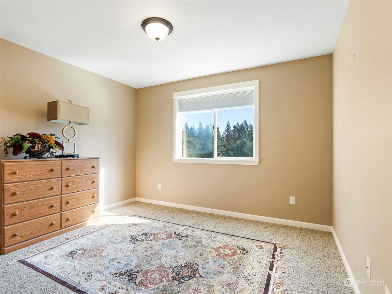 17005 Northeast 33rd Avenue Ridgefield, WA 98642 - Photo 24 of 38 a view of a bedroom with wooden floor