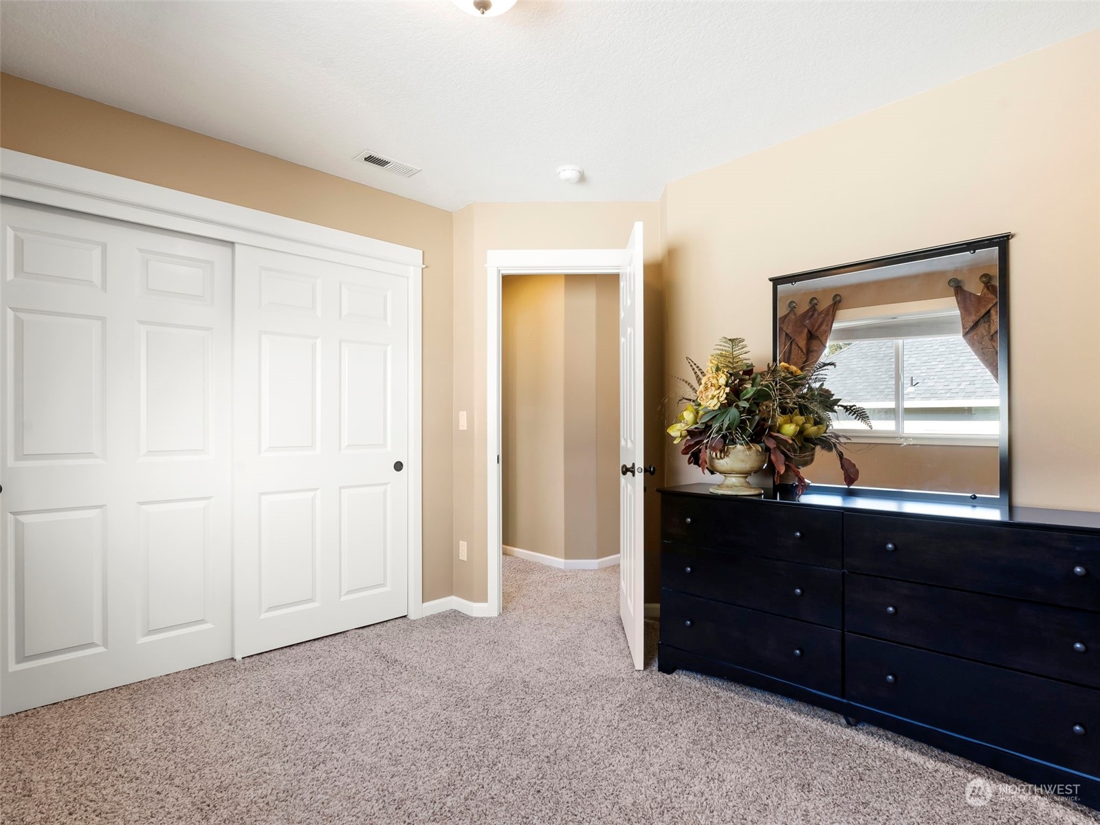 17005 Northeast 33rd Avenue Ridgefield, WA 98642 - Photo 25 of 38 a room with a dresser and mirror