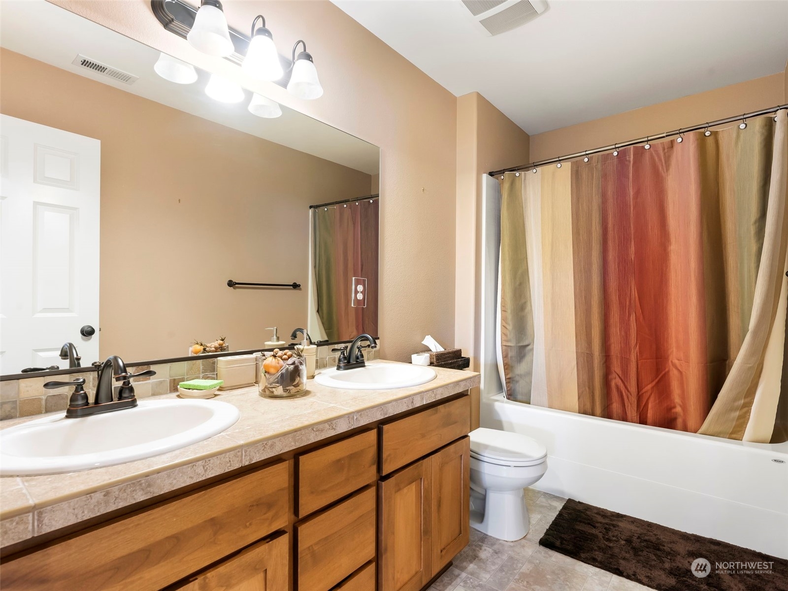 17005 Northeast 33rd Avenue Ridgefield, WA 98642 - Photo 27 of 38 a bathroom with a double vanity sink mirror and toilet