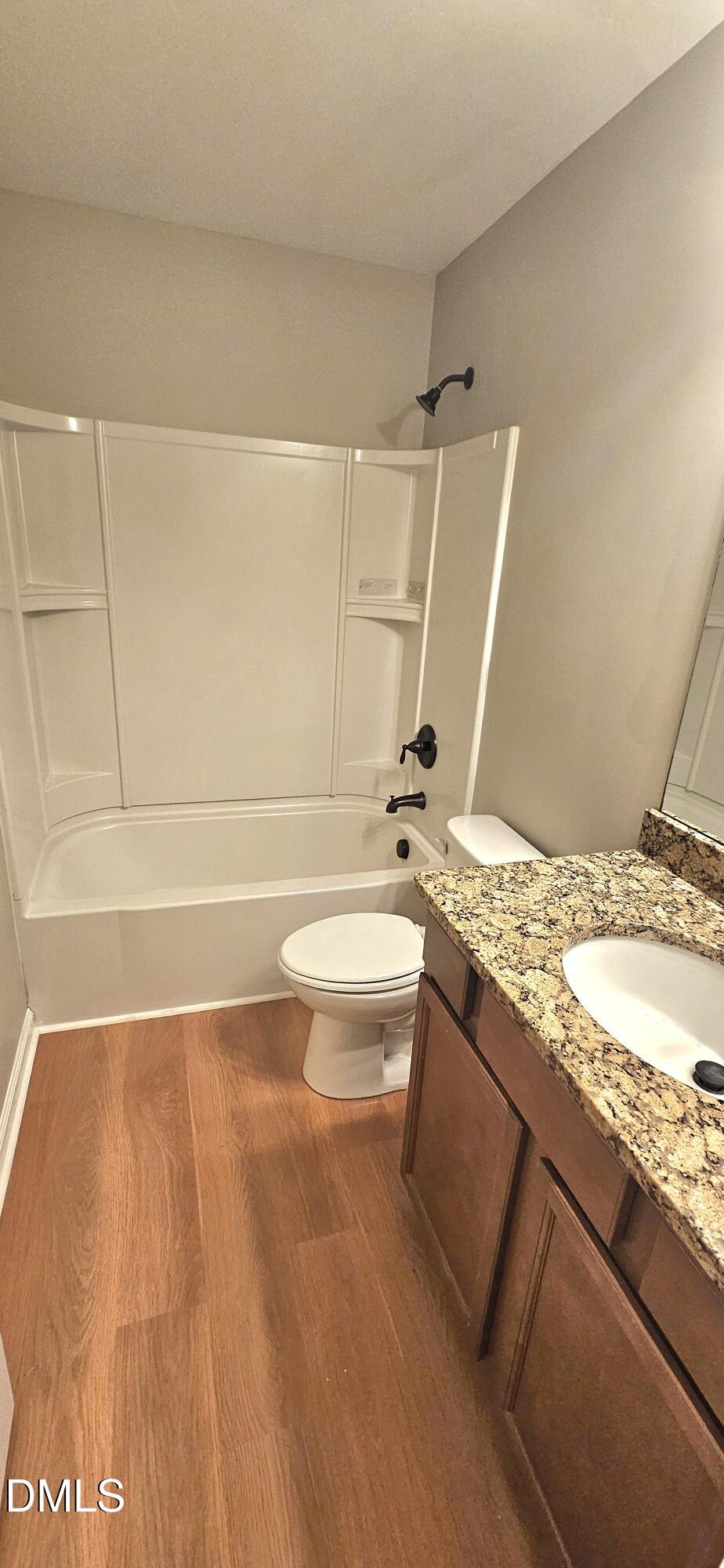 313 Brier Crossings Loop Durham, NC 27703 - Photo 24 of 27 a bathroom with a granite countertop sink toilet and shower
