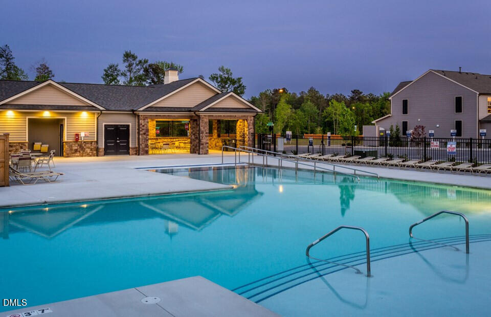 313 Brier Crossings Loop Durham, NC 27703 - Photo 27 of 27 a front view of a house with swimming pool and porch