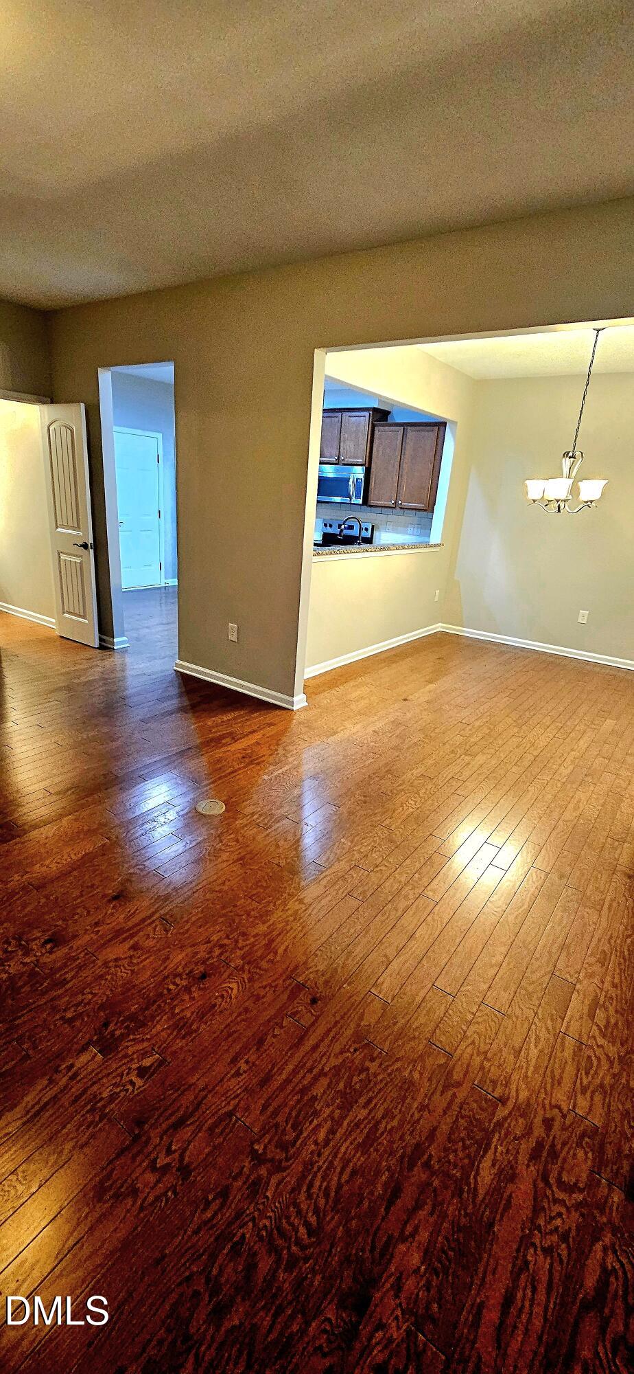 313 Brier Crossings Loop Durham, NC 27703 - Photo 5 of 27 a view of empty room with wooden floor
