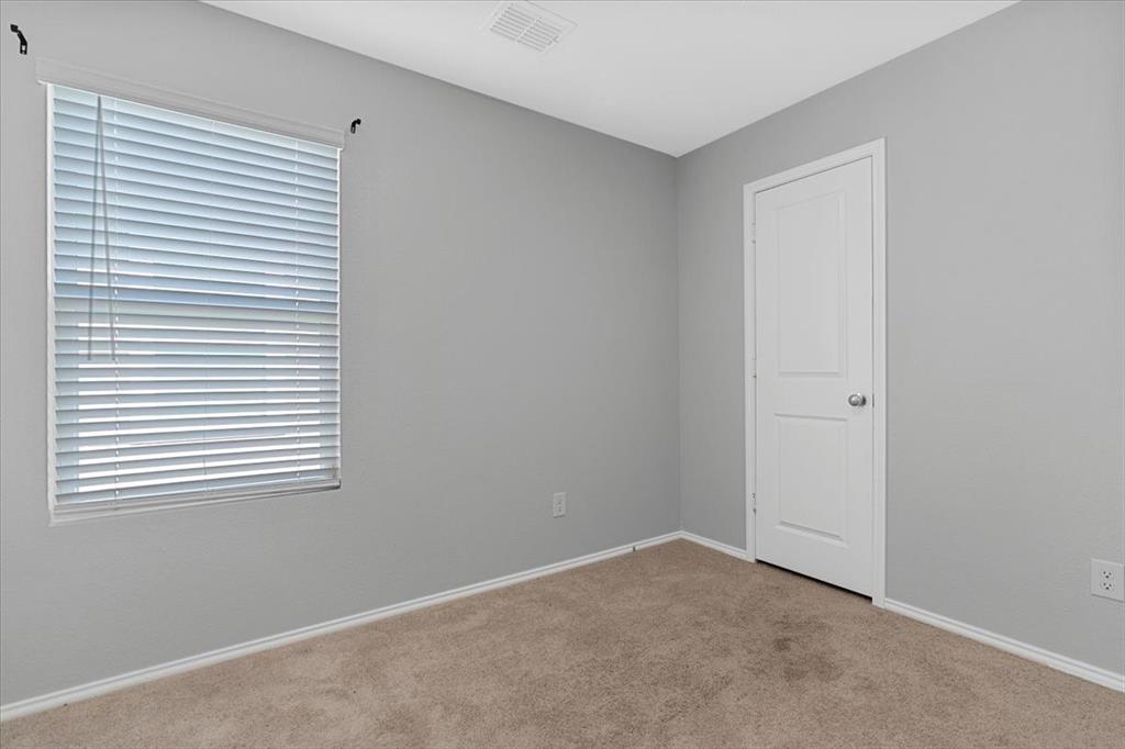 8730 Texas Risinger Drive Fort Worth, TX 76123 - Photo 6 of 19 an empty room with a window