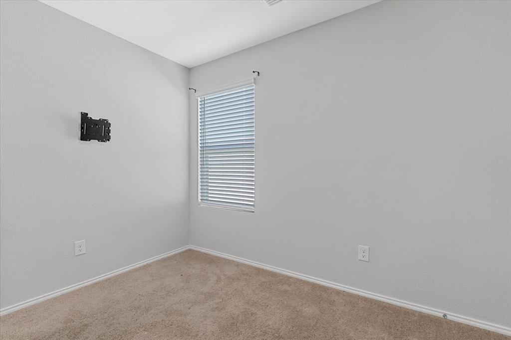 8730 Texas Risinger Drive Fort Worth, TX 76123 - Photo 7 of 19 an empty room with a window