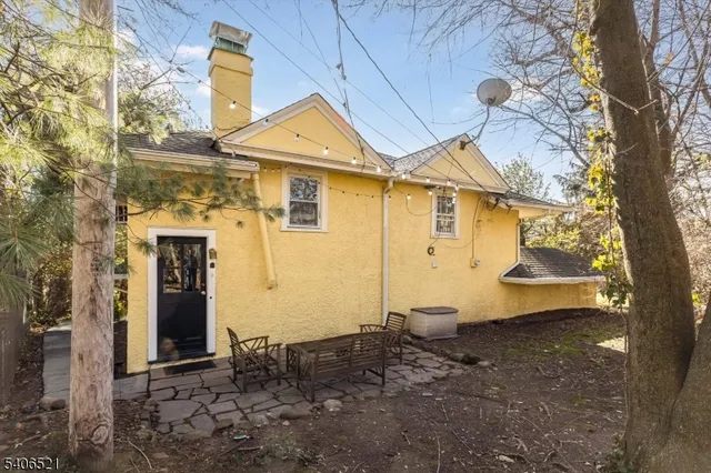 a front view of a house with parking space