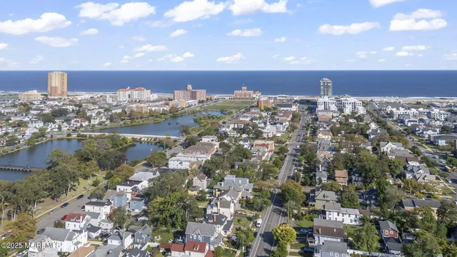 a view of a building with mountains in the background