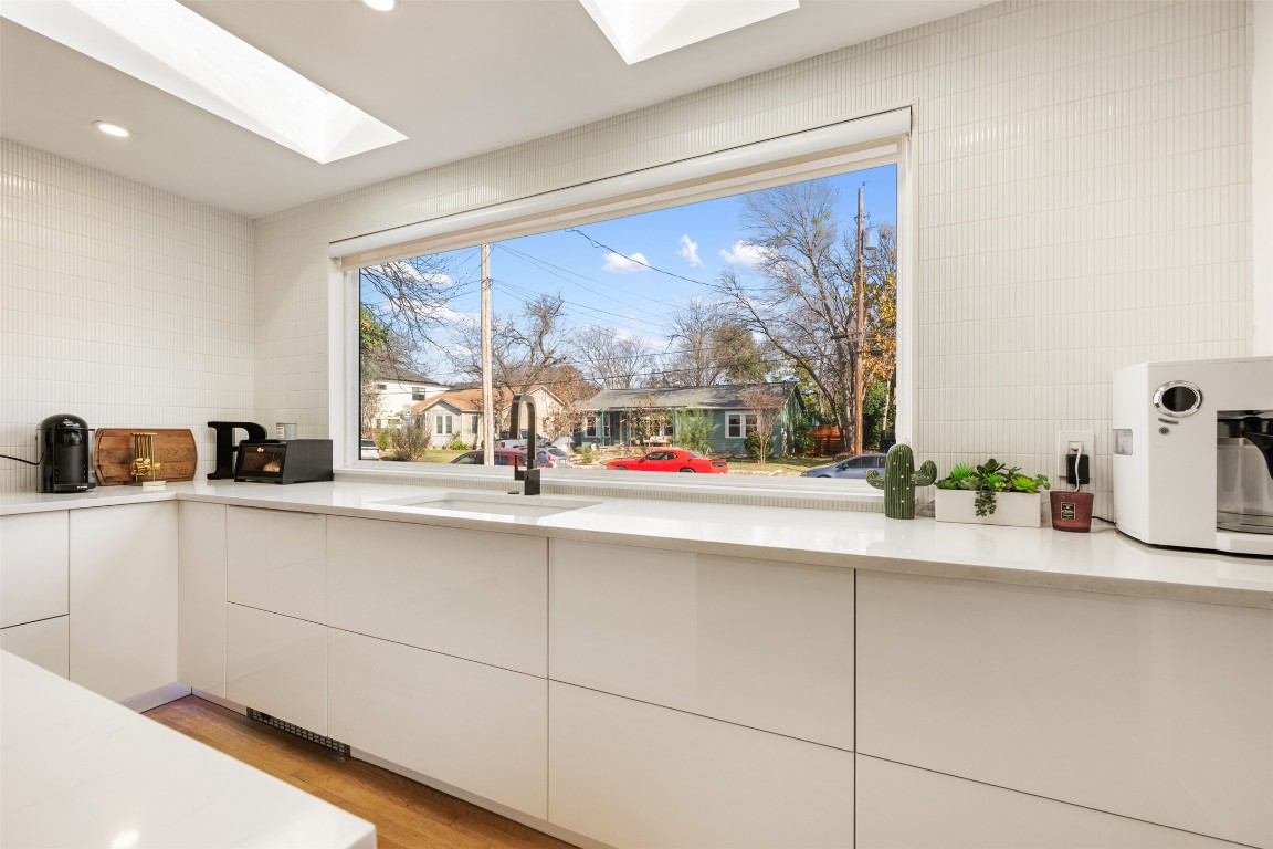 1403 Palo Duro Road Austin, TX 78757 - Photo 11 of 34 a kitchen with a sink and a large window