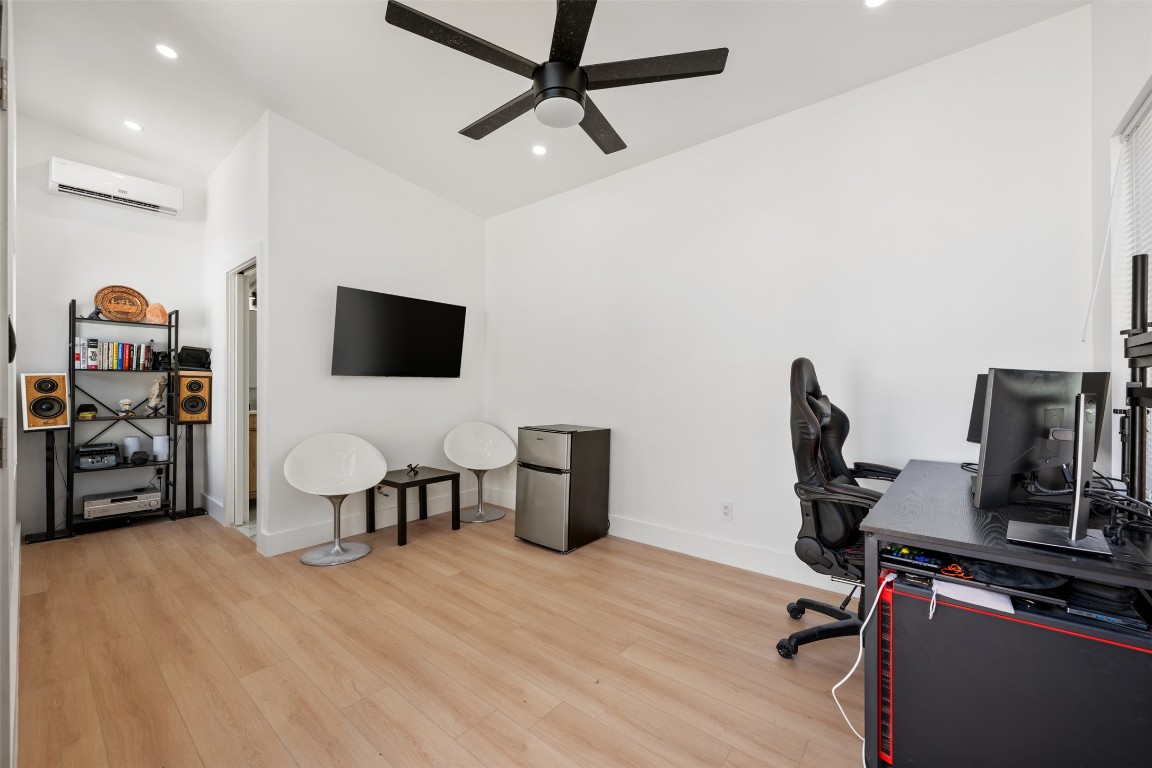1403 Palo Duro Road Austin, TX 78757 - Photo 27 of 34 a view of a workspace with furniture and gym equipment