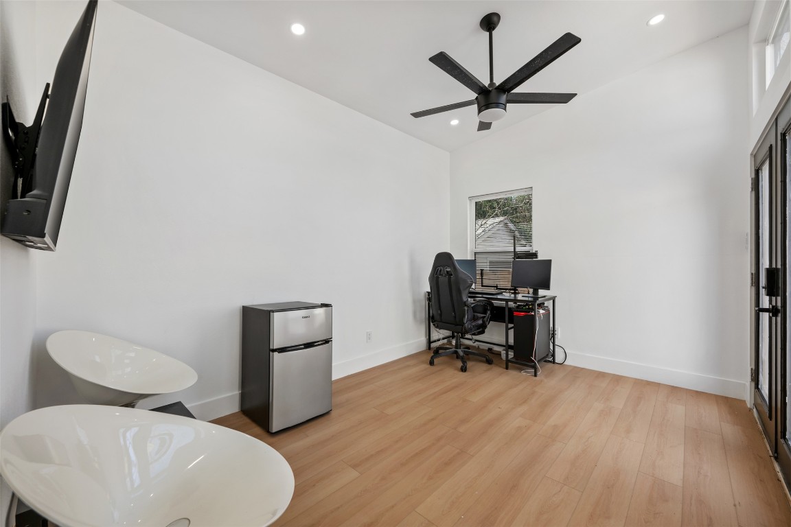1403 Palo Duro Road Austin, TX 78757 - Photo 28 of 34 a workspace with furniture and wooden floor
