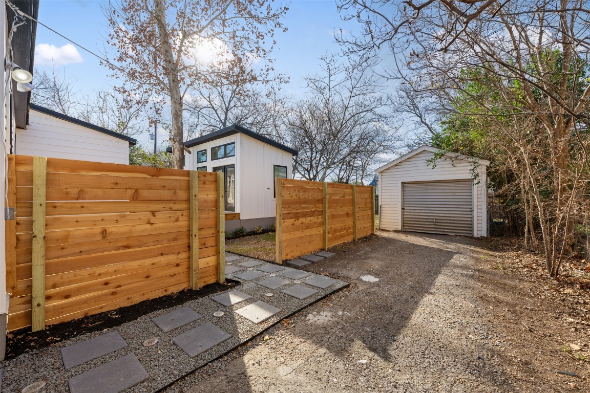 1403 Palo Duro Road Austin, TX 78757 - Photo 34 of 34 a view of a house with a large tree and wooden fence
