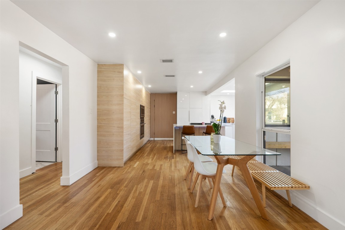 1403 Palo Duro Road Austin, TX 78757 - Photo 6 of 34 a view of a dining room with furniture and wooden floor