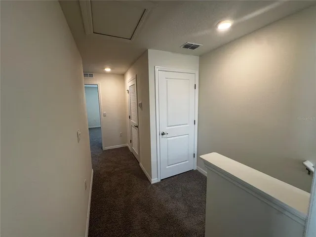 a view of a hallway with an empty room