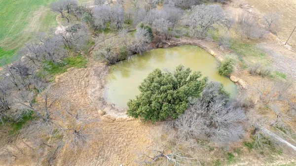 a view of a field with an outdoor space