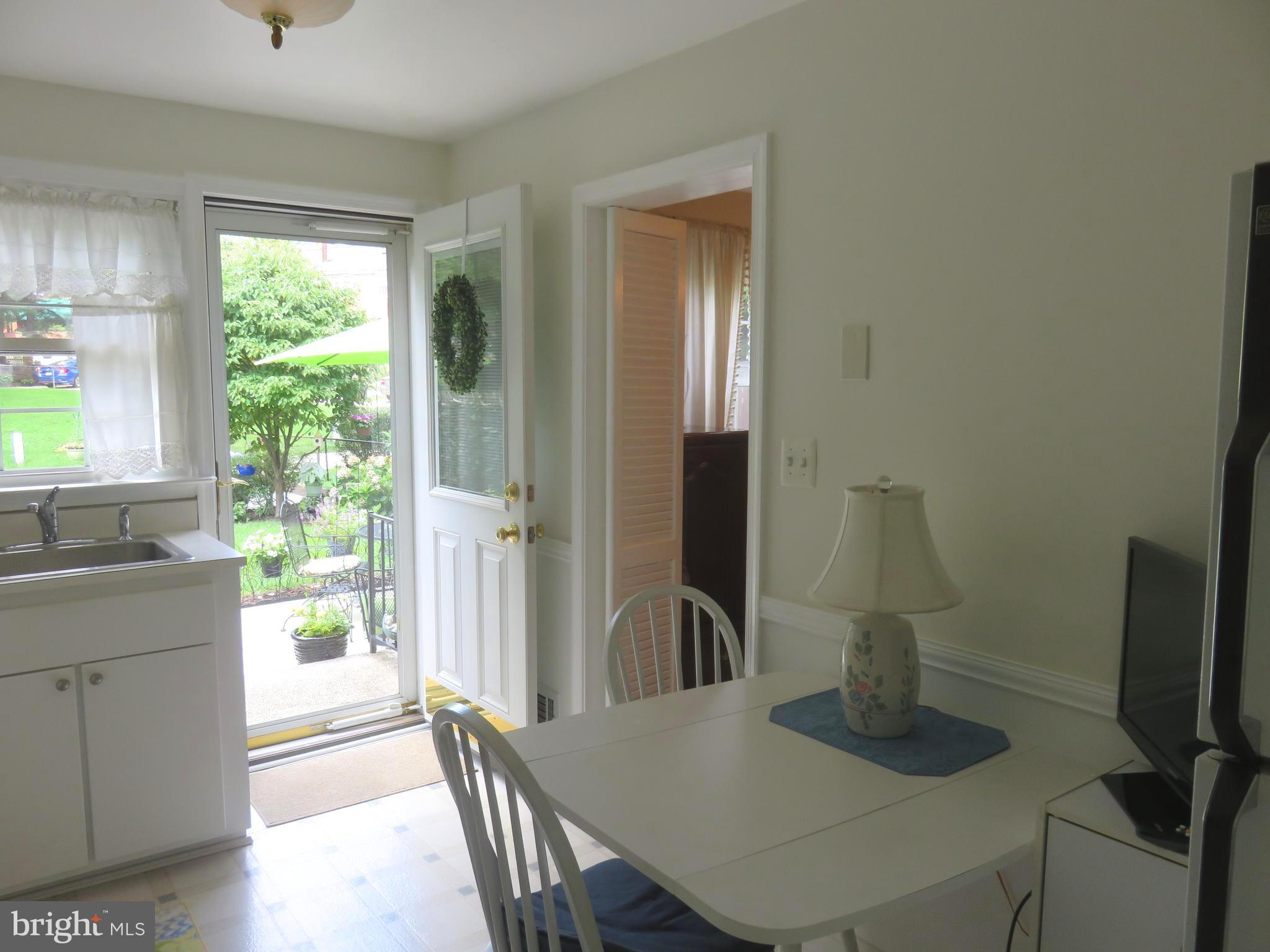 8428 Pleasant Plains Road Baltimore, MD 21286 - Photo 11 of 29 a dining room with furniture and a window