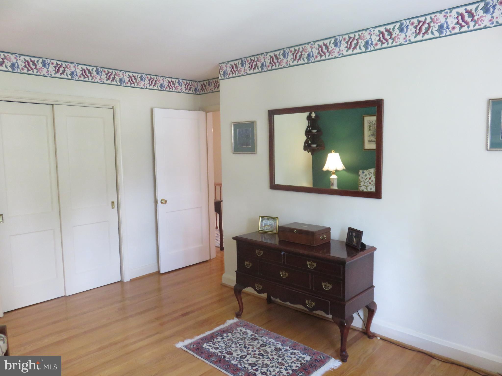 8428 Pleasant Plains Road Baltimore, MD 21286 - Photo 16 of 29 a living room with furniture and a flat screen tv