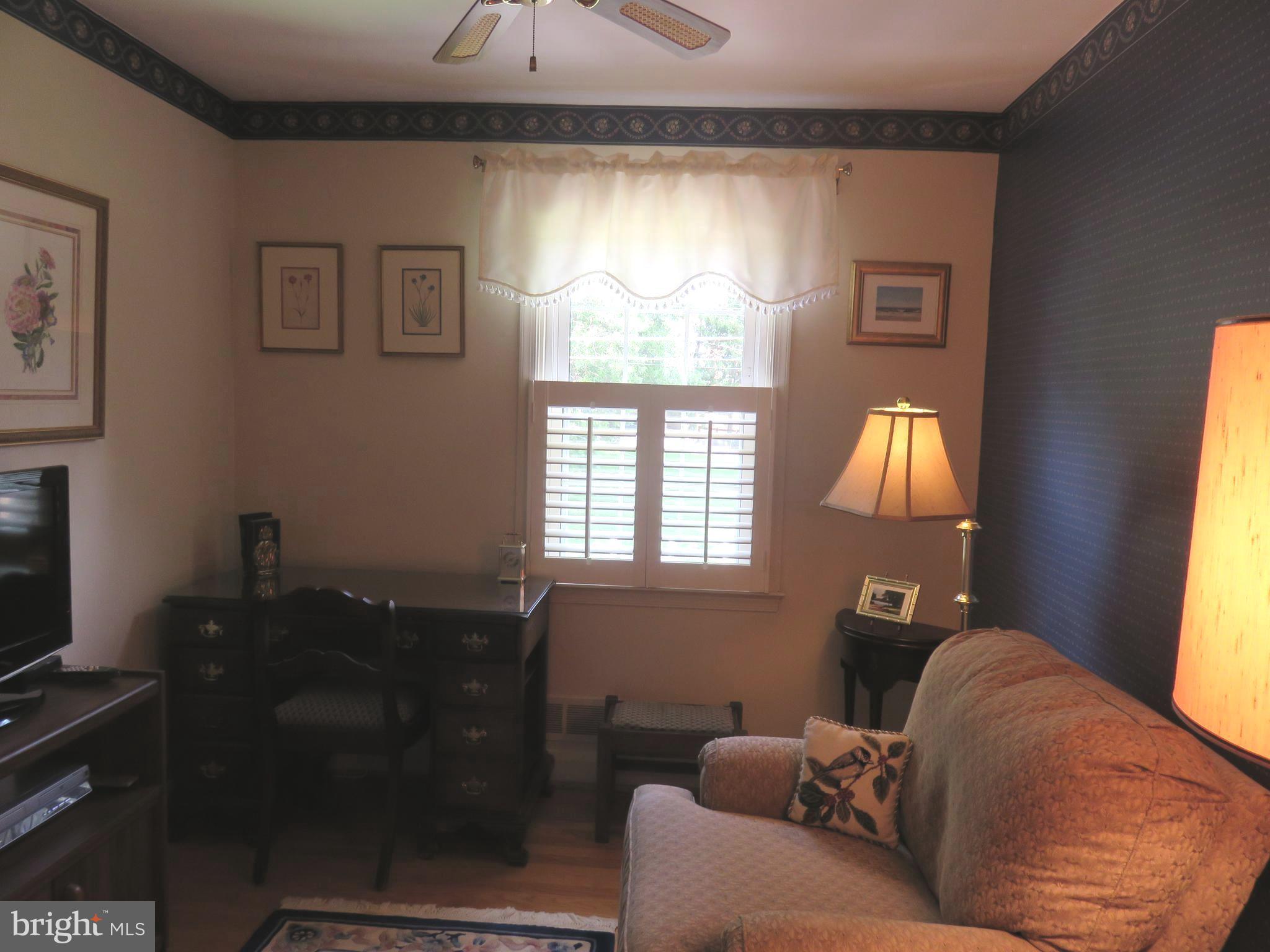 8428 Pleasant Plains Road Baltimore, MD 21286 - Photo 17 of 29 a living room with furniture and a window