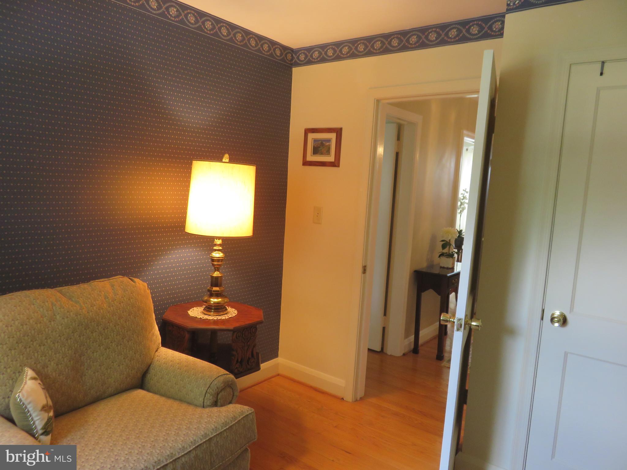 8428 Pleasant Plains Road Baltimore, MD 21286 - Photo 18 of 29 a living room with furniture and a window