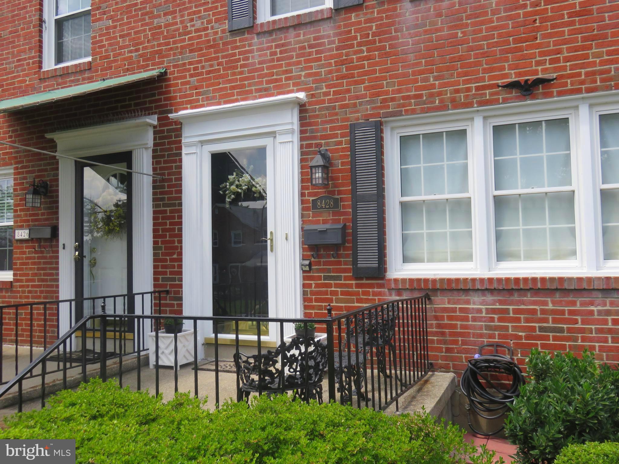 8428 Pleasant Plains Road Baltimore, MD 21286 - Photo 24 of 29 a couple of potted plants in front of a brick building