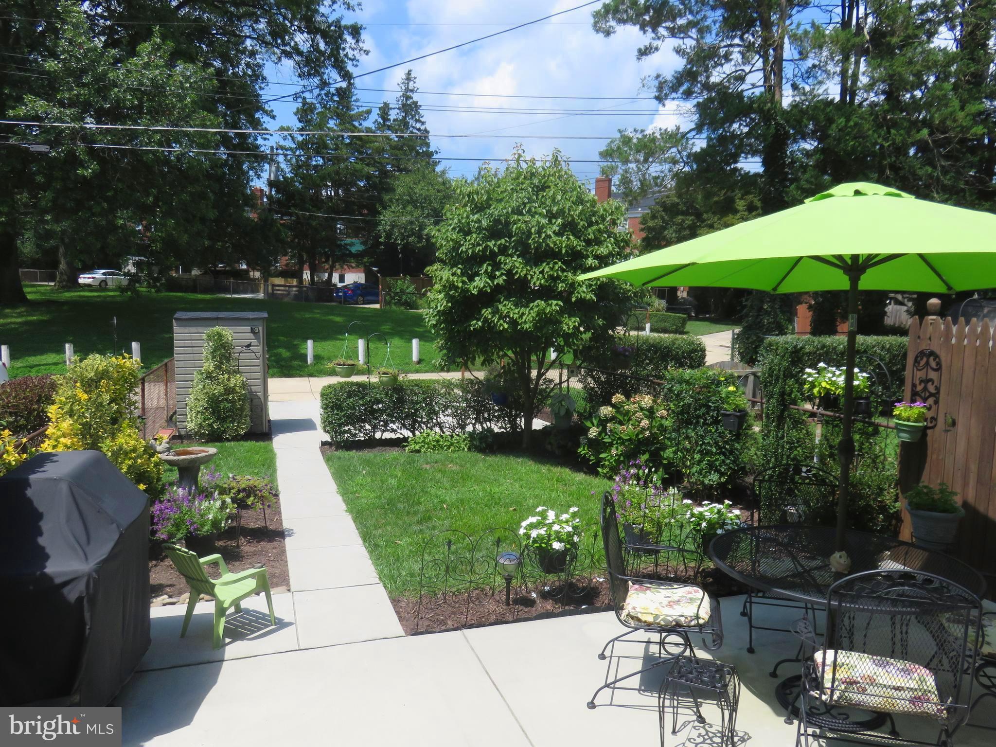 8428 Pleasant Plains Road Baltimore, MD 21286 - Photo 25 of 29 a view of a table and chairs under an umbrella