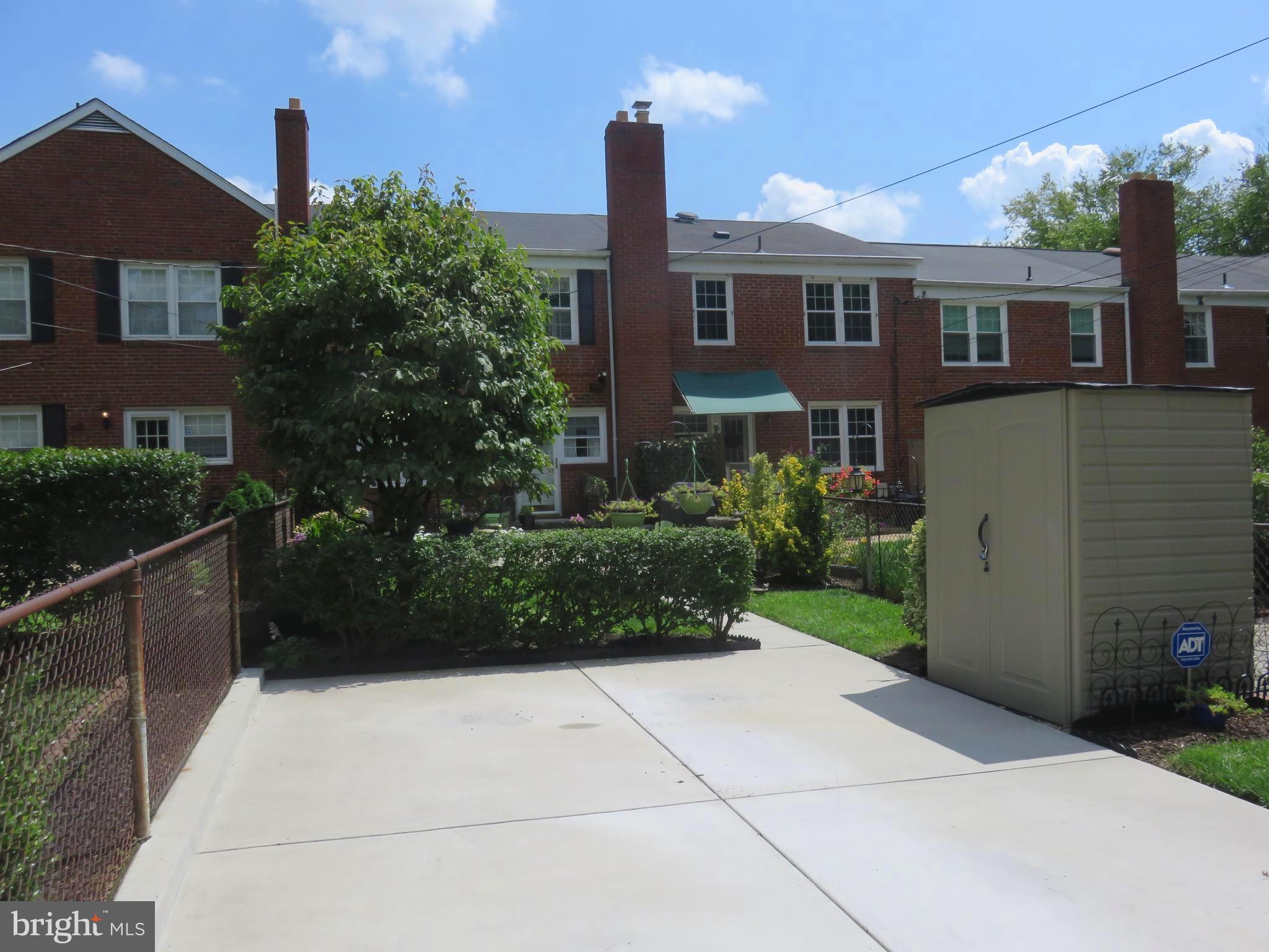8428 Pleasant Plains Road Baltimore, MD 21286 - Photo 28 of 29 a front view of a house with garden