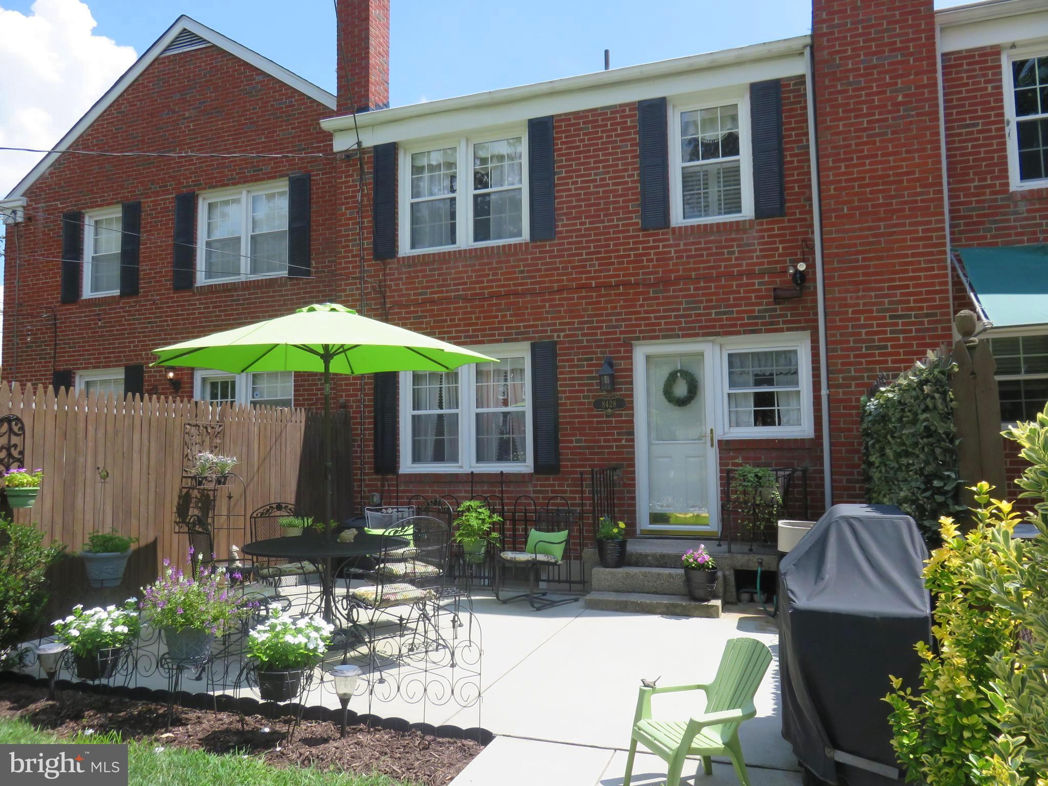 8428 Pleasant Plains Road Baltimore, MD 21286 - Photo 29 of 29 a view of a brick house with chairs and tables