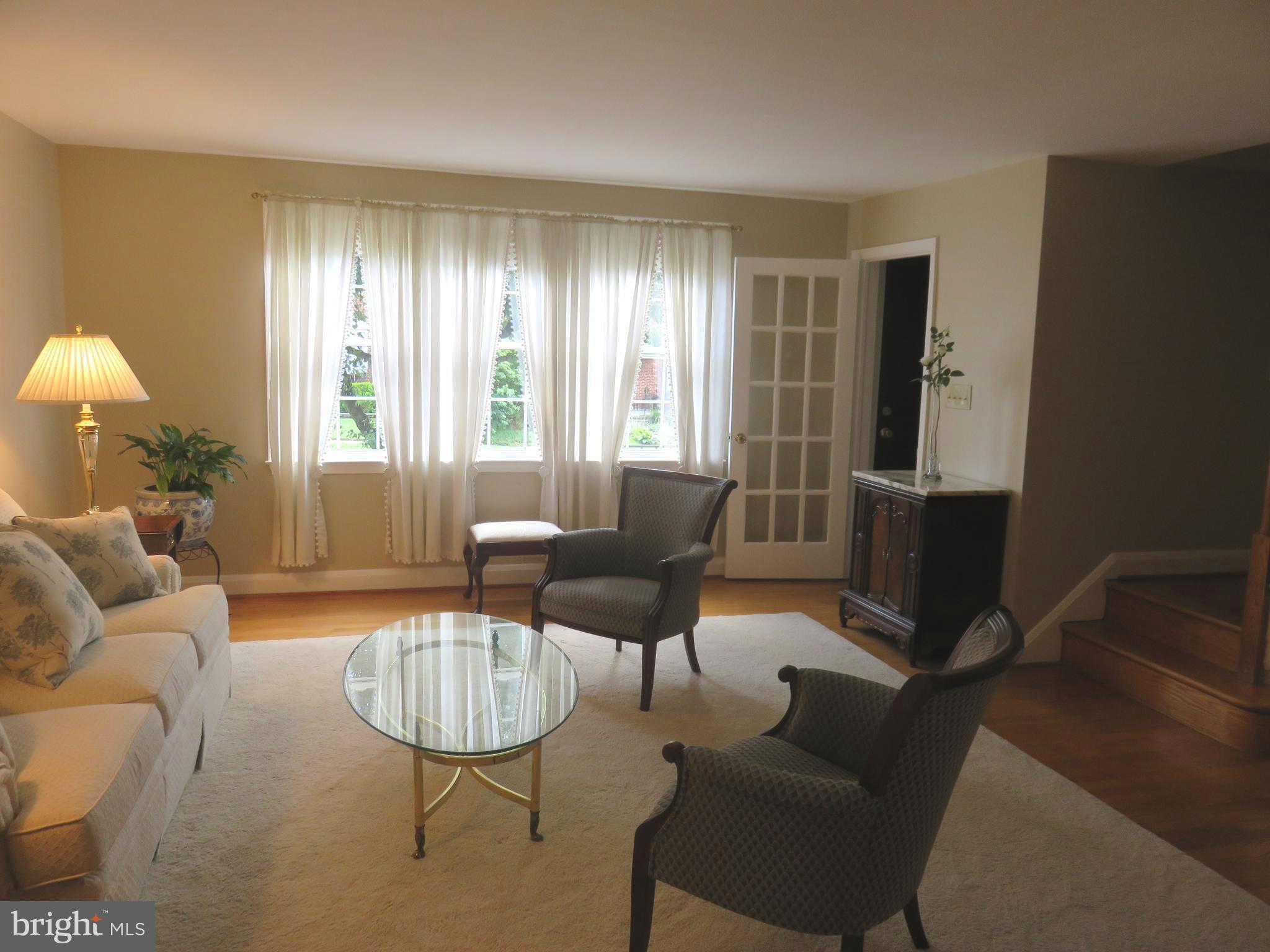 8428 Pleasant Plains Road Baltimore, MD 21286 - Photo 5 of 29 a living room with furniture and a window
