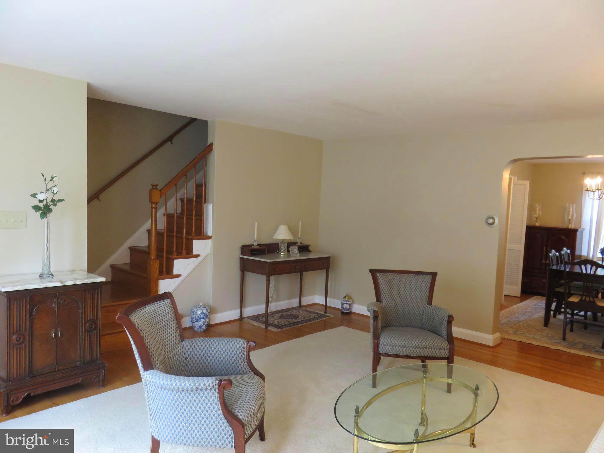 8428 Pleasant Plains Road Baltimore, MD 21286 - Photo 6 of 29 a living room with furniture and a dining room