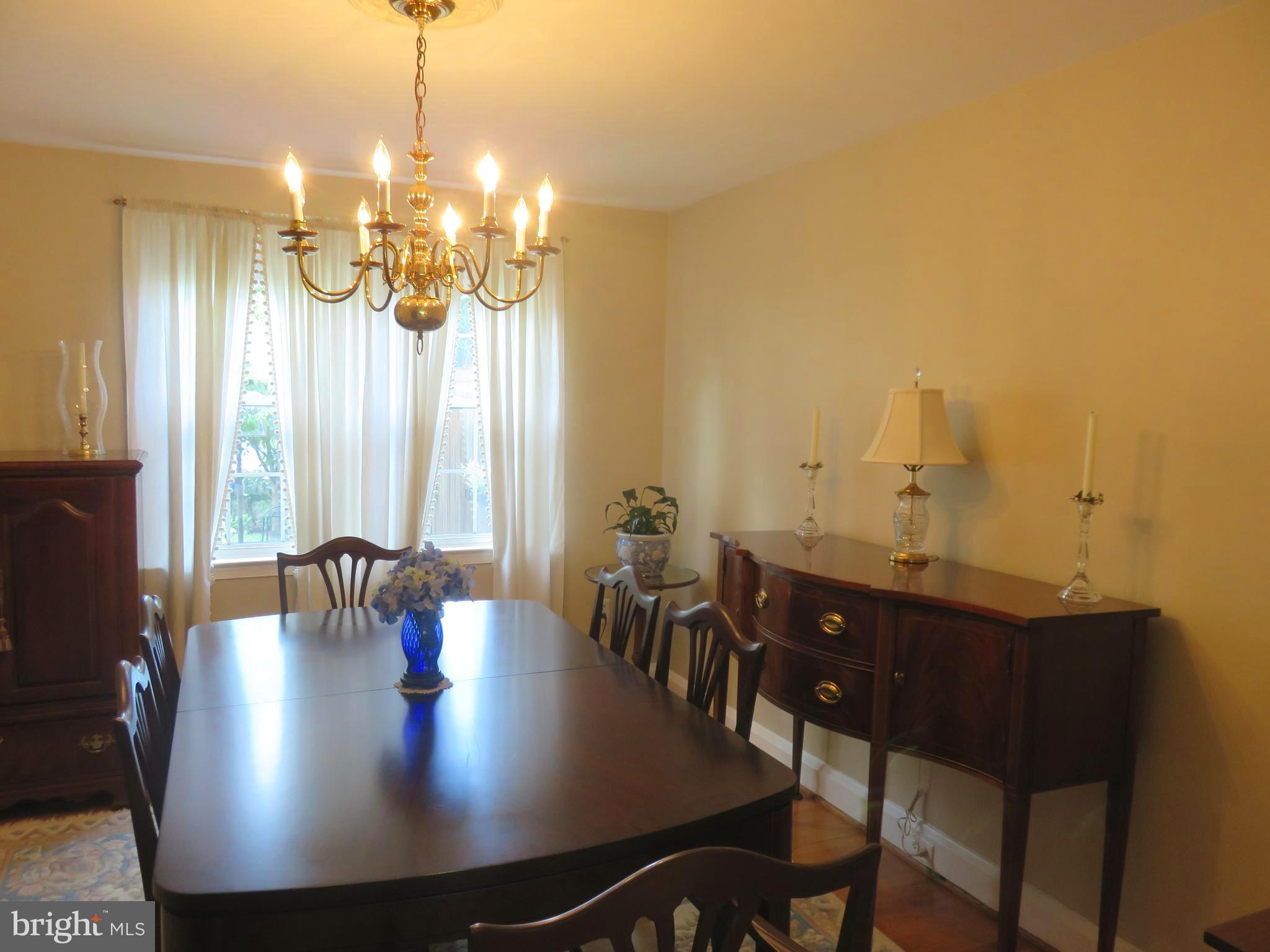 8428 Pleasant Plains Road Baltimore, MD 21286 - Photo 9 of 29 a view of a dining room with furniture and chandelier