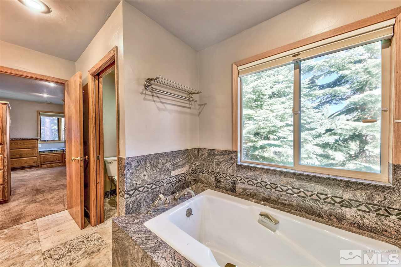 218 Terrace View Drive Stateline, NV 89449 - Photo 12 of 22 a bathroom with bathtub and a shower