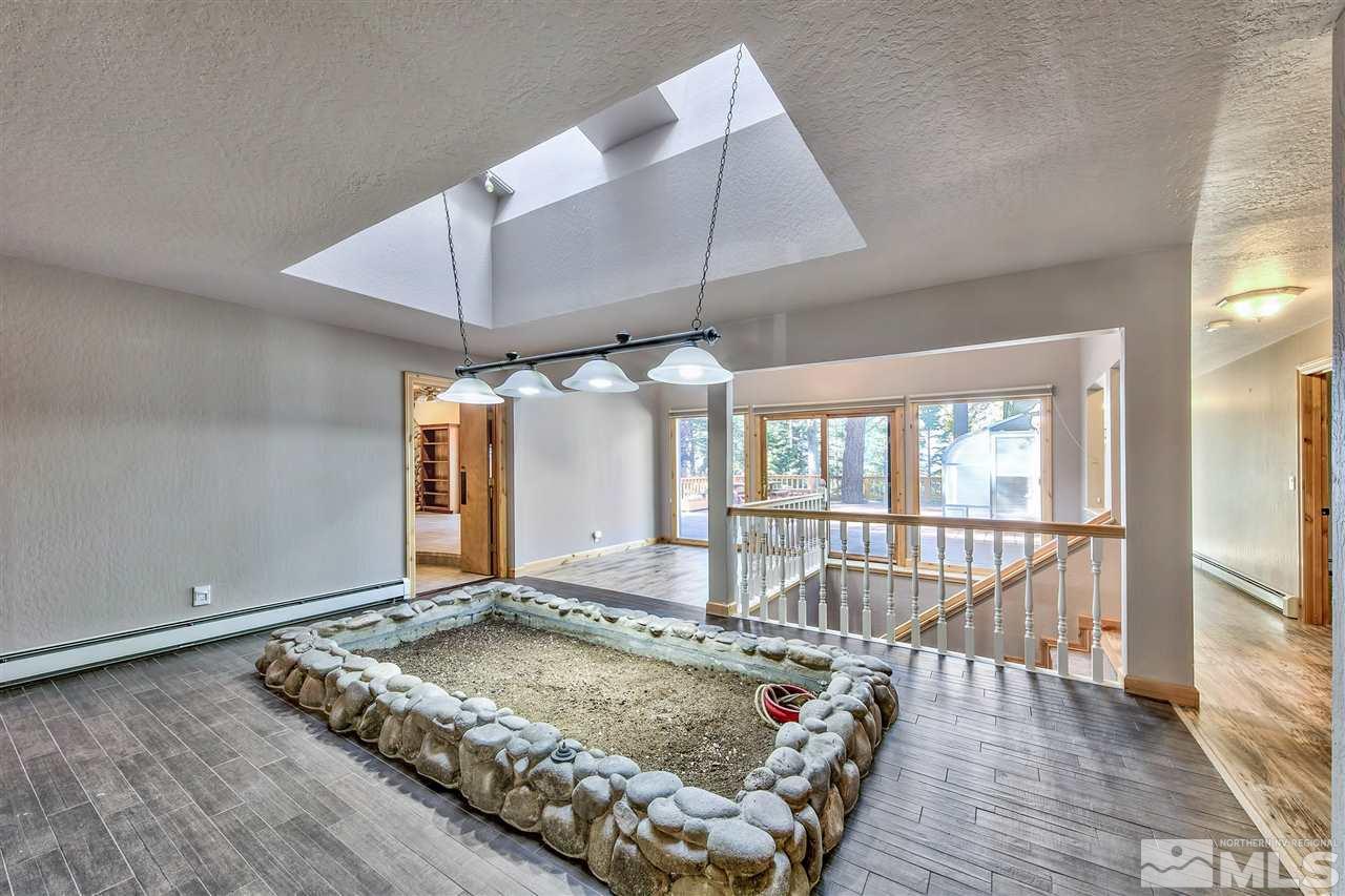 218 Terrace View Drive Stateline, NV 89449 - Photo 22 of 22 an outdoor space with wooden floor and umbrella