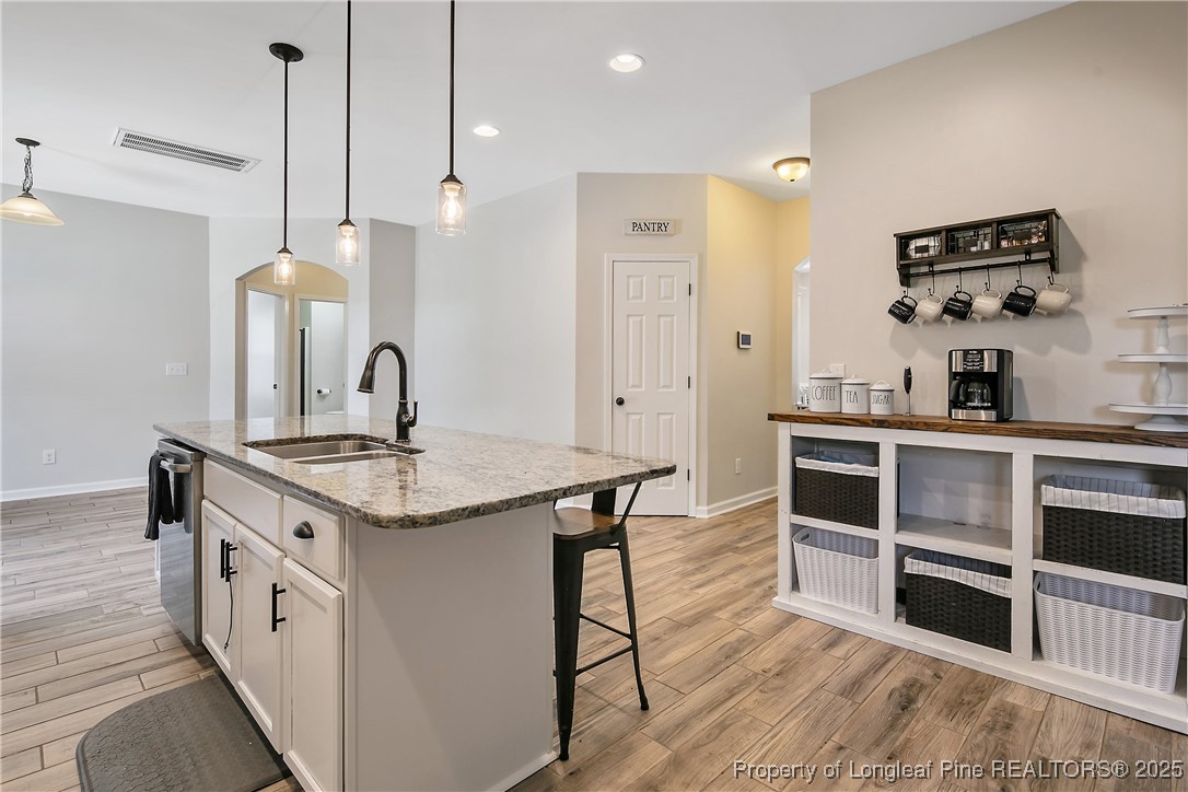 101 Shepard Drive Linden, NC 28356 - Photo 16 of 50 a kitchen with stainless steel appliances a stove a sink and cabinets