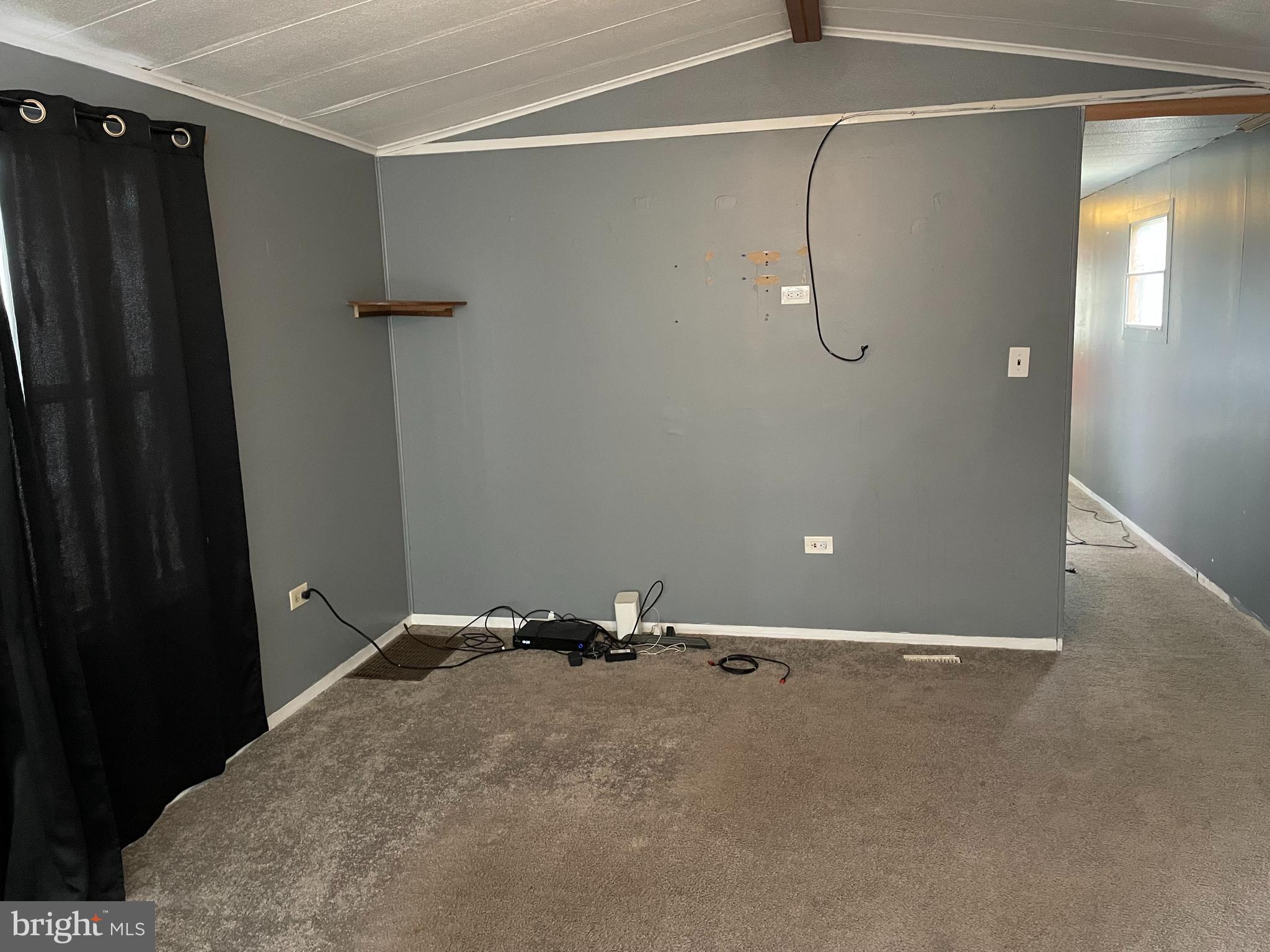 23 Maple Drive, Unit 16 Newark, DE 19713 - Photo 3 of 9 a view of a room with racks on the wall