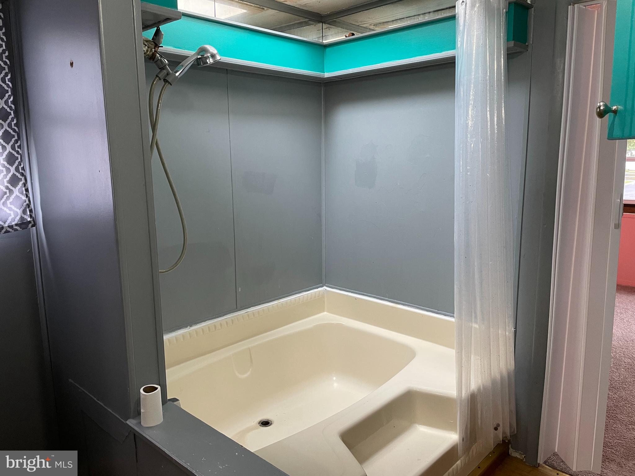 23 Maple Drive, Unit 16 Newark, DE 19713 - Photo 6 of 9 a bathroom with a bathtub and shower