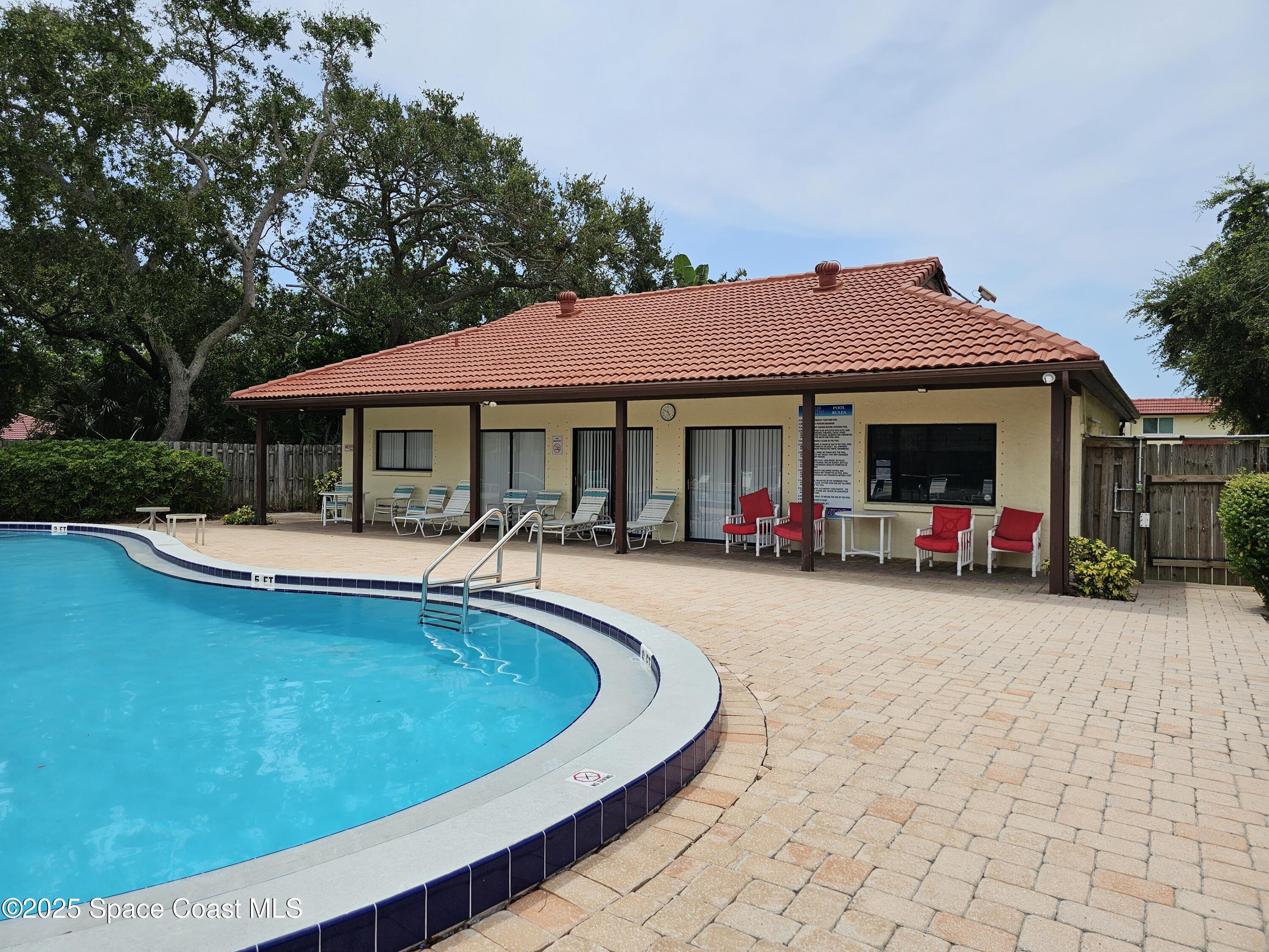 8761 Ilex Court Cape Canaveral, FL 32920 - Photo 29 of 41 a view of outdoor space yard swimming pool and porch