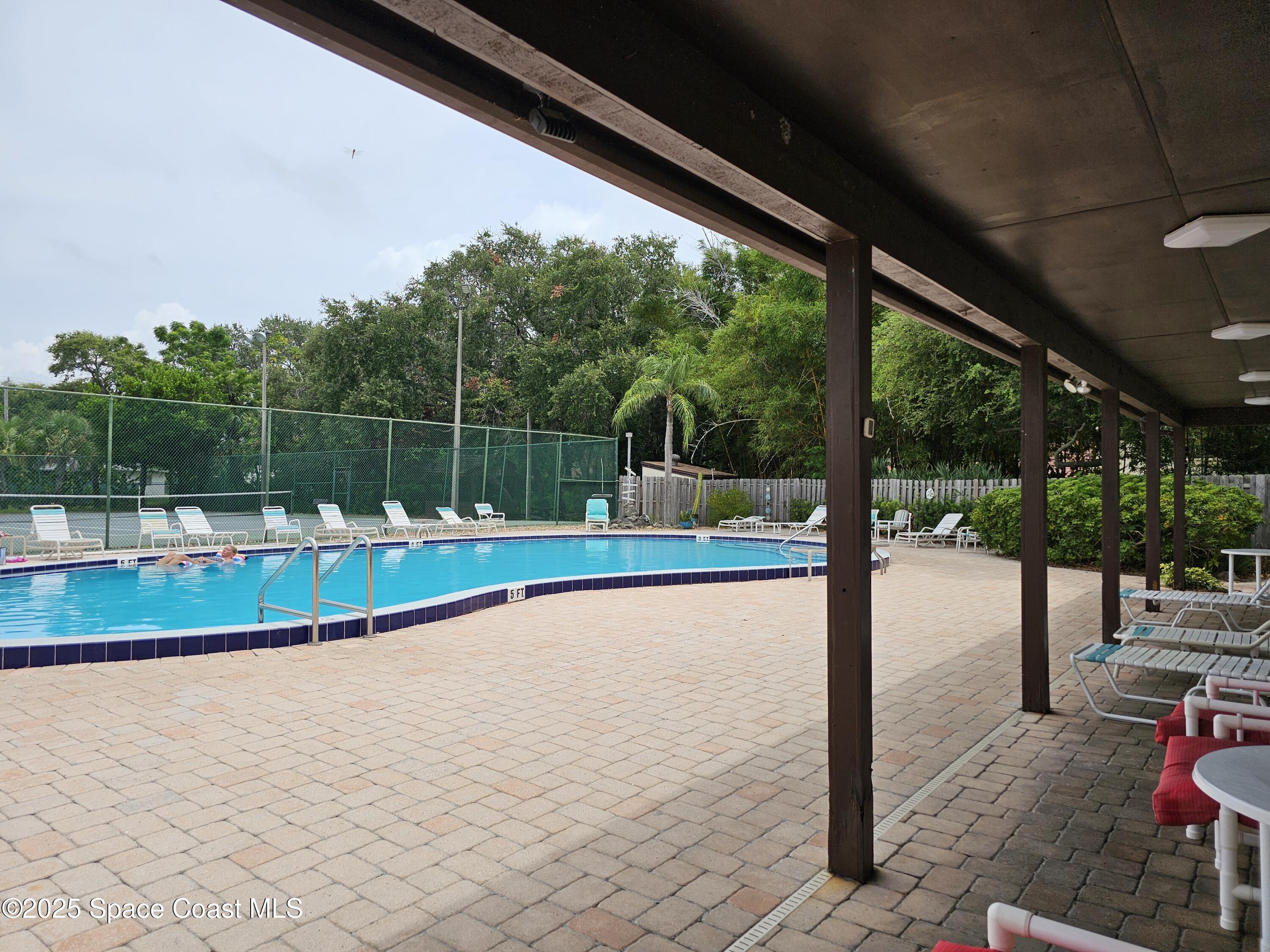 8761 Ilex Court Cape Canaveral, FL 32920 - Photo 30 of 41 a view of swimming pool