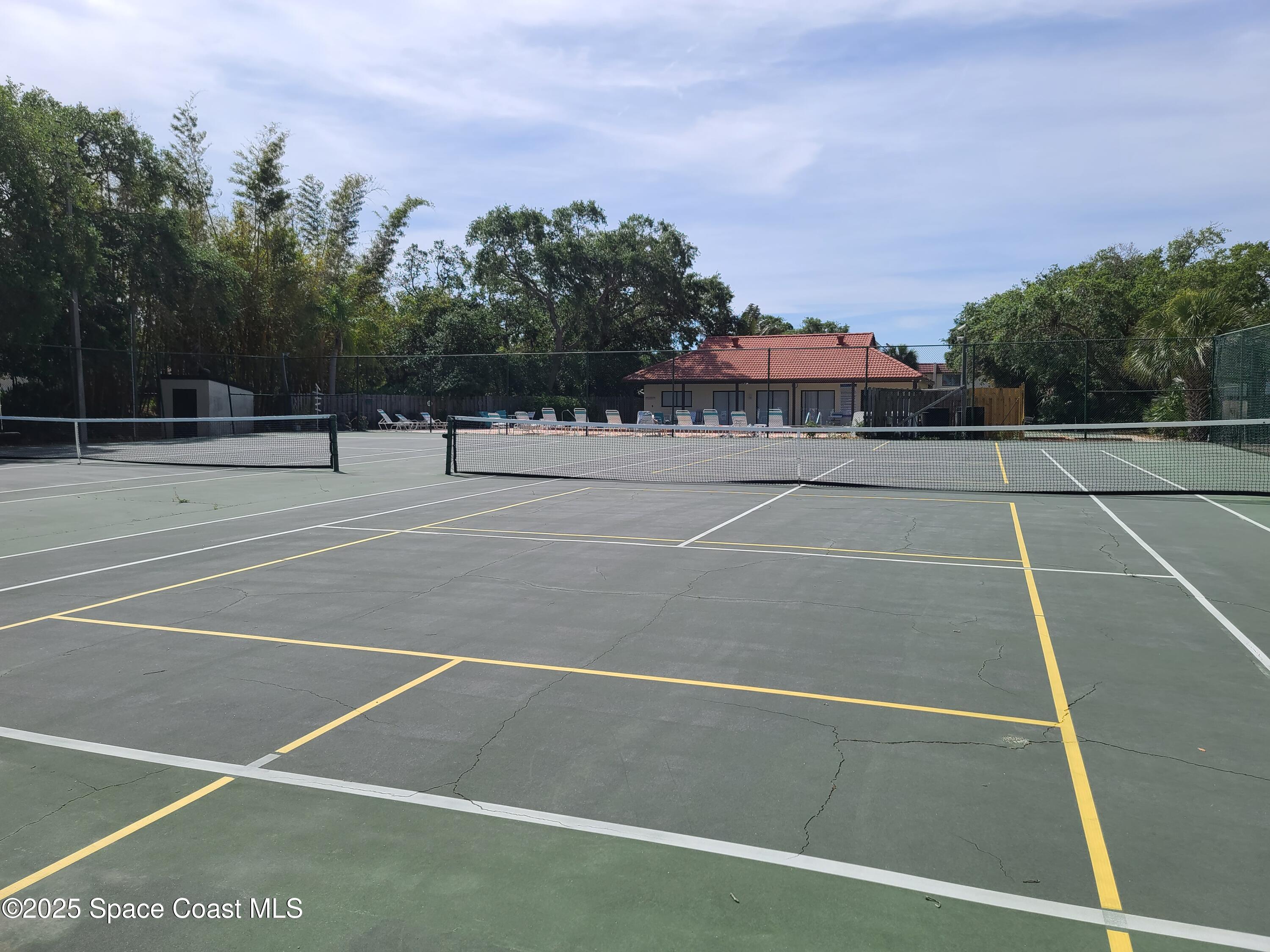 8761 Ilex Court Cape Canaveral, FL 32920 - Photo 32 of 41 a view of a tennis court