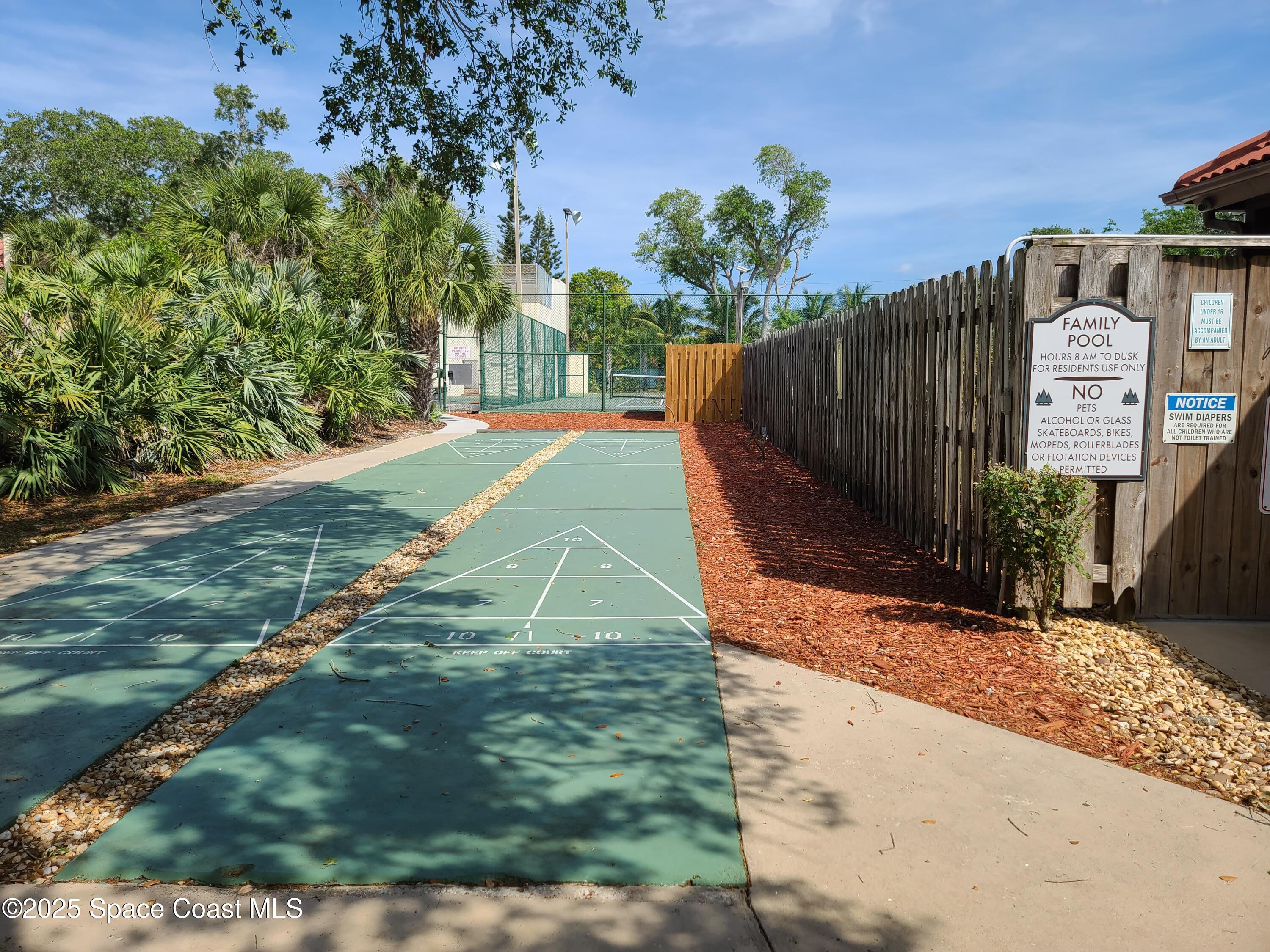 8761 Ilex Court Cape Canaveral, FL 32920 - Photo 34 of 41 a view of a backyard