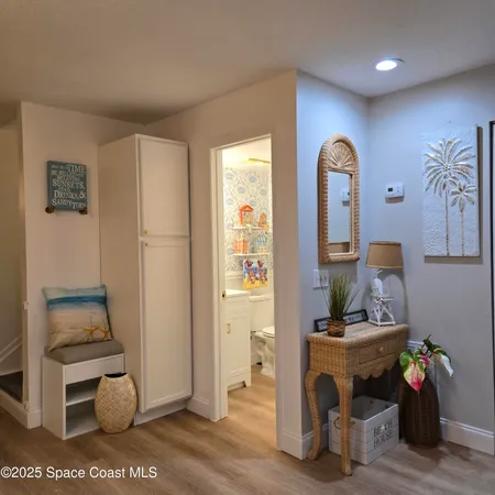 a view of room with furniture and wooden floor