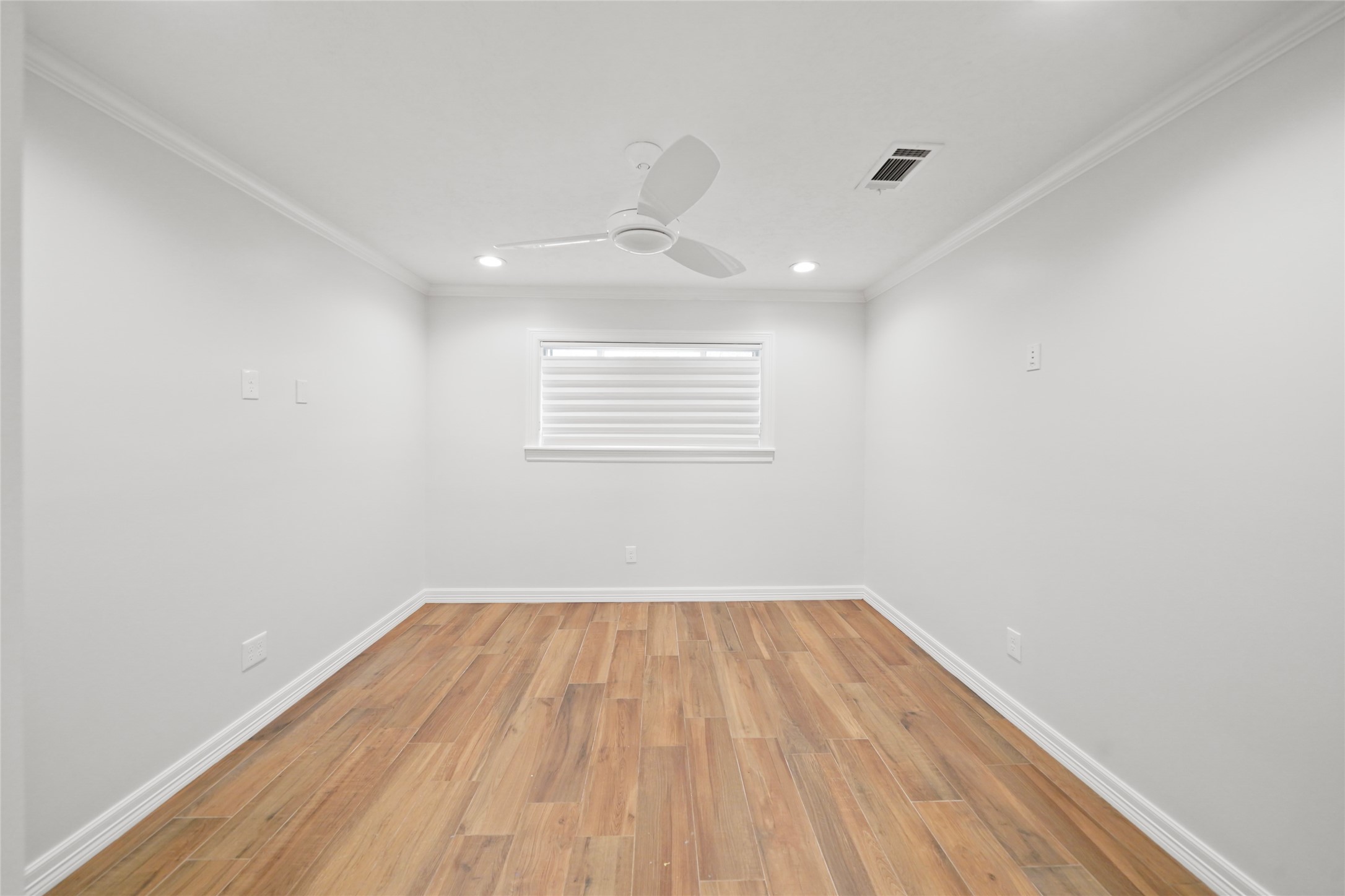 12201 FM 2759 Road Richmond, TX 77469 - Photo 17 of 50 a view of empty room with wooden floor and fan