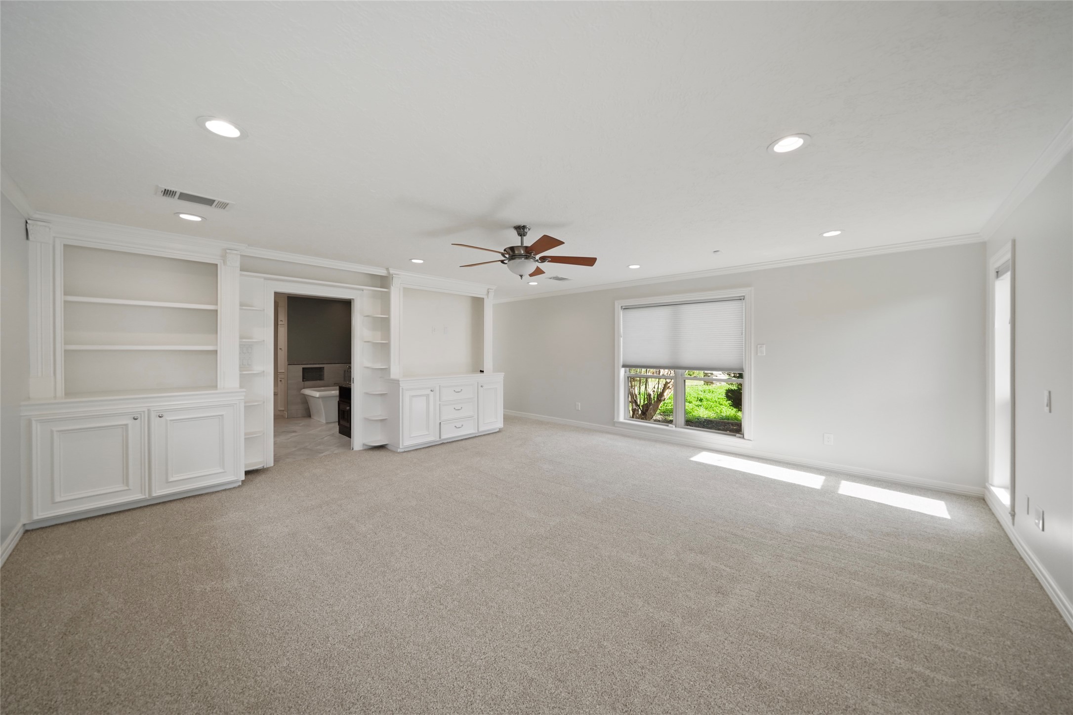 12201 FM 2759 Road Richmond, TX 77469 - Photo 20 of 50 an empty room with windows and cabinet