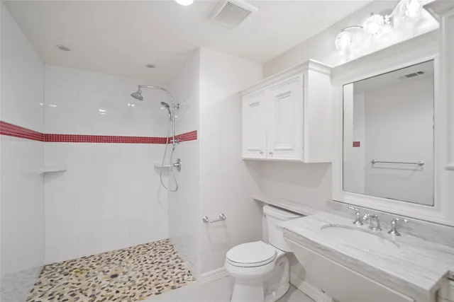 a bathroom with a granite countertop sink mirror and double