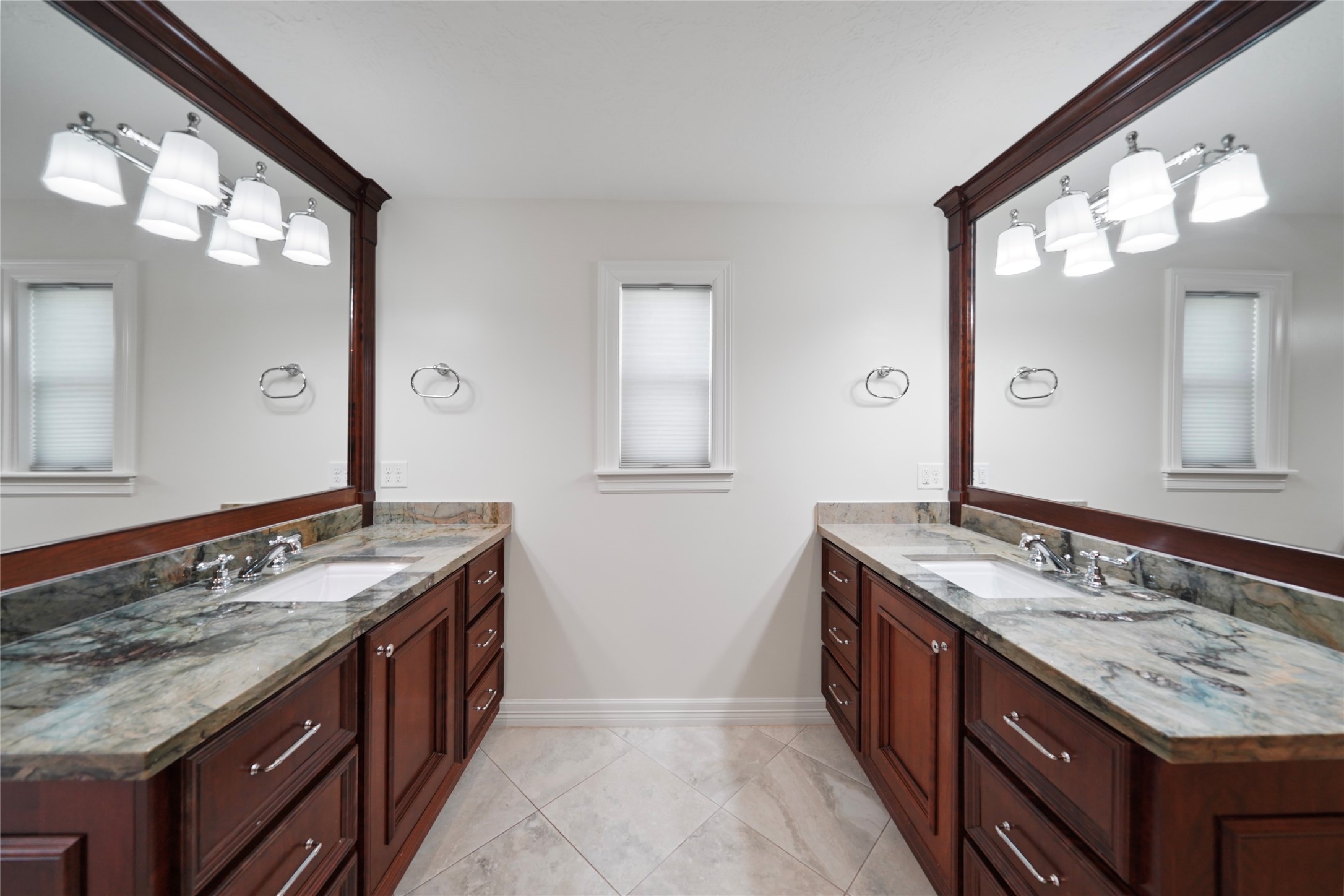 12201 FM 2759 Road Richmond, TX 77469 - Photo 25 of 50 a bathroom with a granite countertop double vanity sink and a mirror