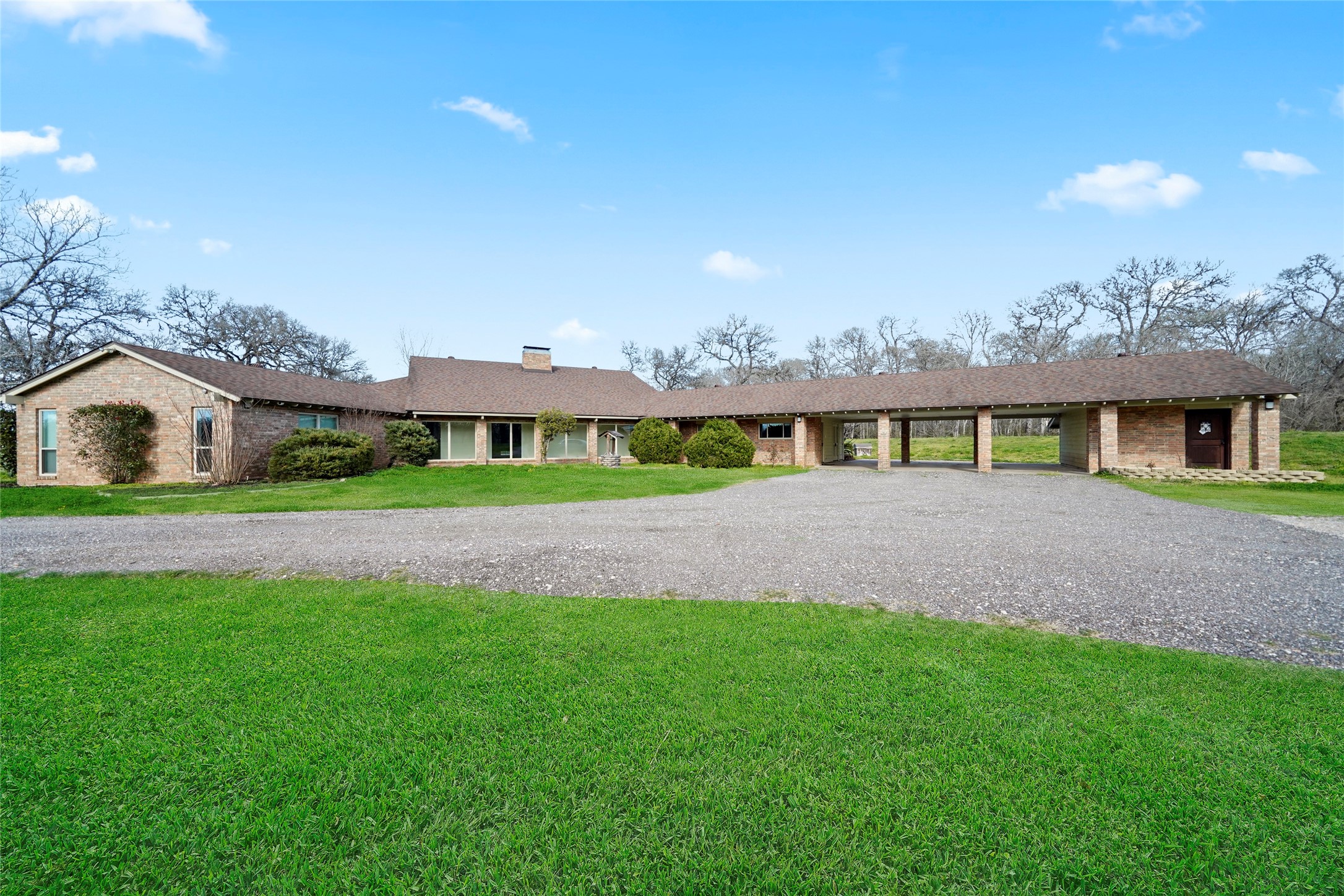 12201 FM 2759 Road Richmond, TX 77469 - Photo 34 of 50 a front view of a house with a yard and garage
