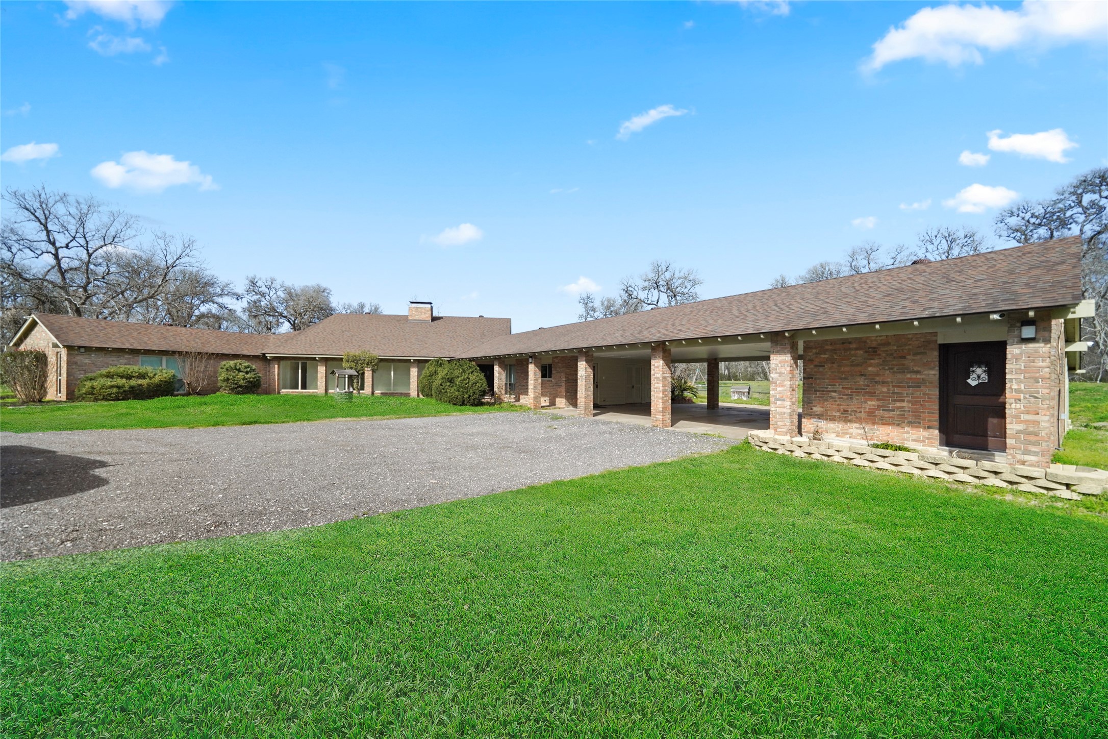 12201 FM 2759 Road Richmond, TX 77469 - Photo 35 of 50 a front view of a house with a garden and yard