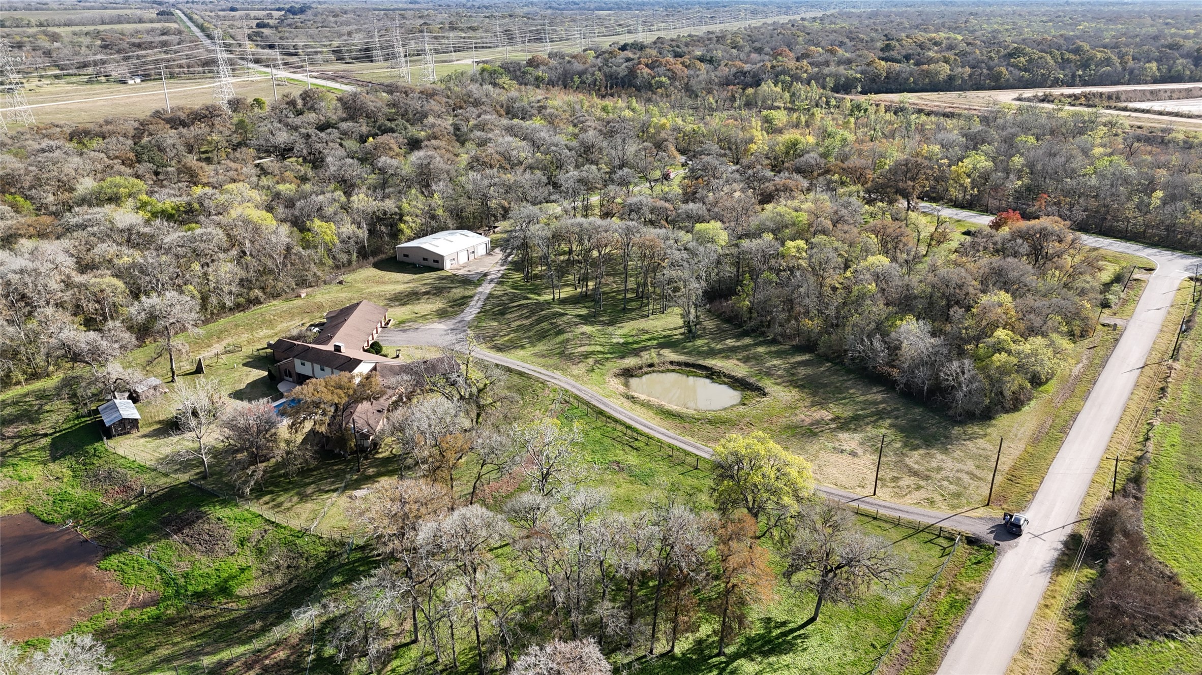 12201 FM 2759 Road Richmond, TX 77469 - Photo 50 of 50 a aerial view of a house with a yard and lake view