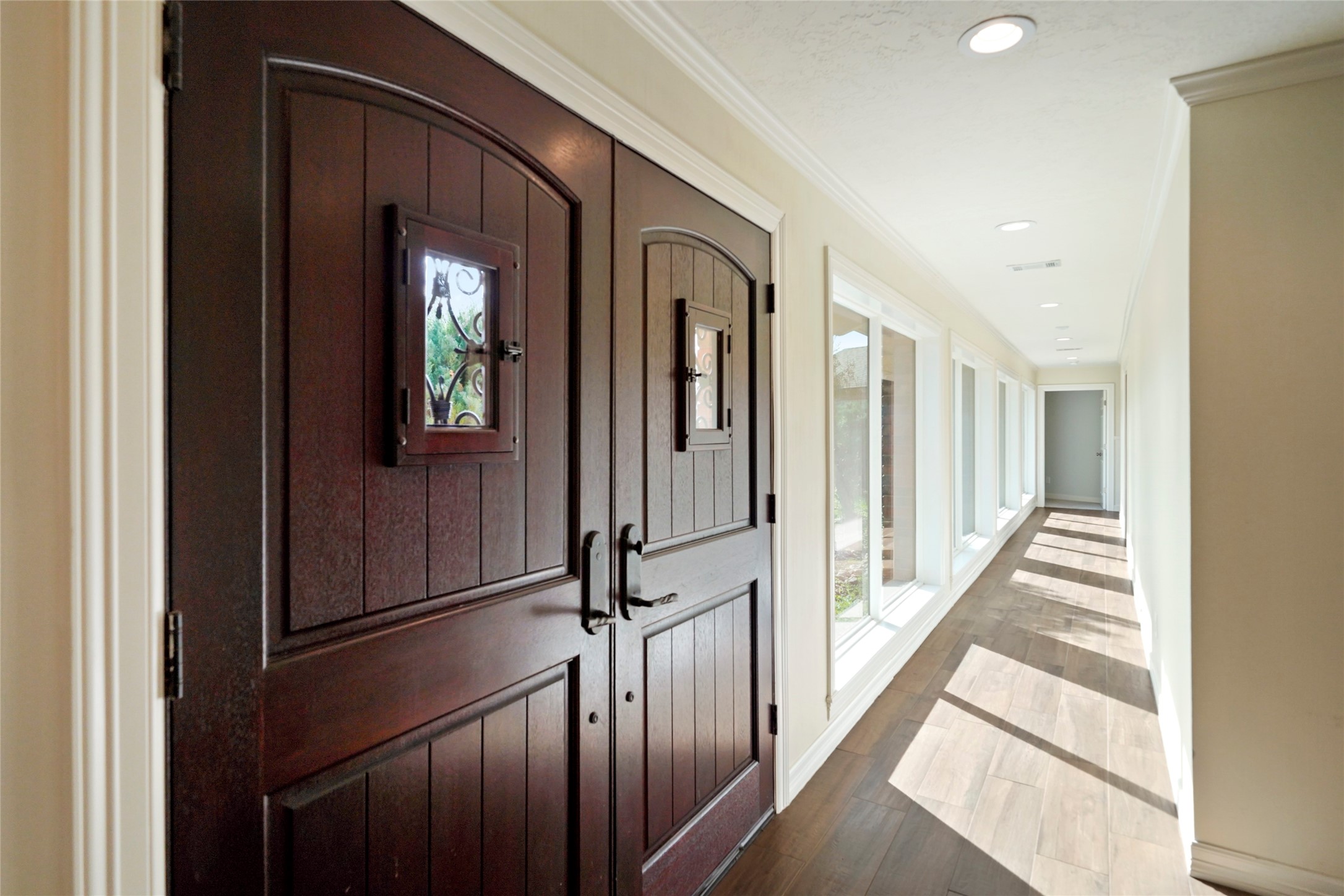 12201 FM 2759 Road Richmond, TX 77469 - Photo 7 of 50 a view of a hallway with wooden floor and staircase