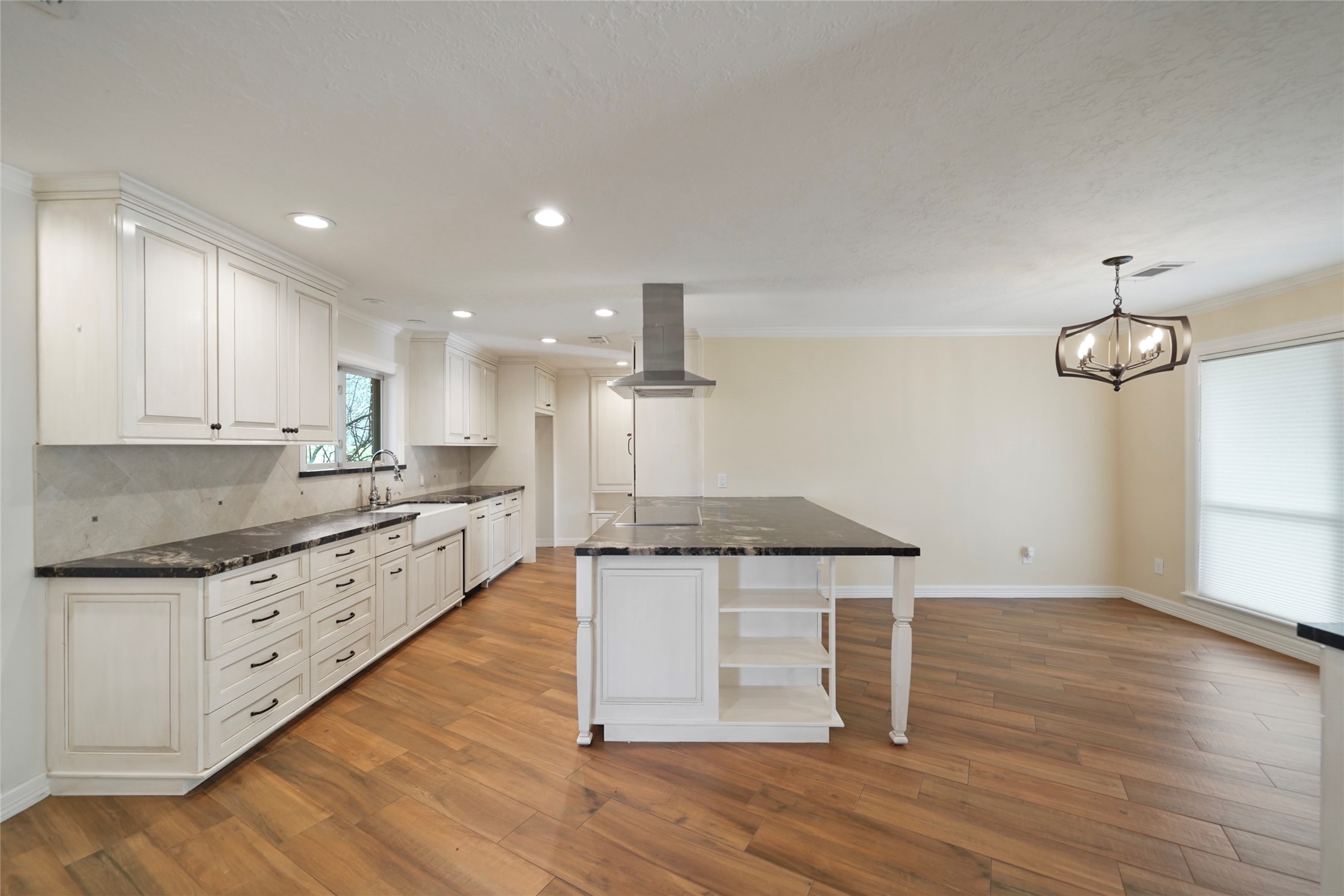 12201 FM 2759 Road Richmond, TX 77469 - Photo 9 of 50 a kitchen with granite countertop a stove and a wooden floors