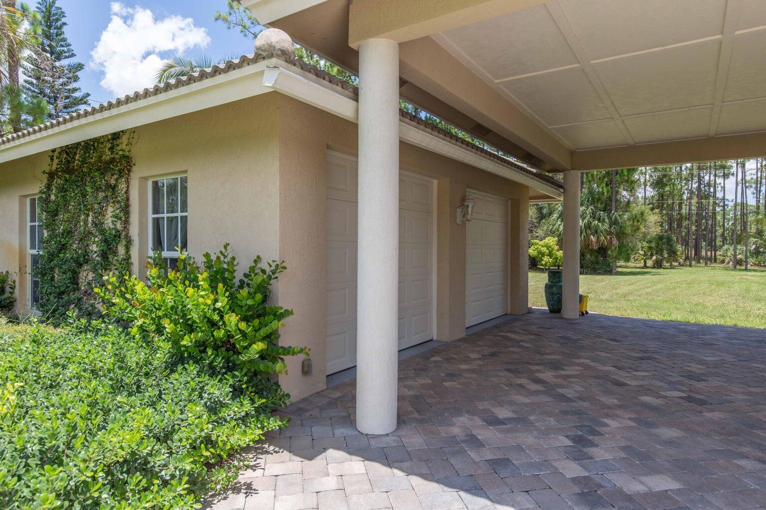 14816 Stirrup Lane Wellington, FL 33414 - Photo 28 of 30 a view of a house with a yard