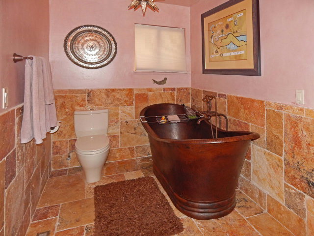 25530 Vía Paloma Carmel, CA 93923 - Photo 12 of 23 a room with a painting on the wall and a potted plant